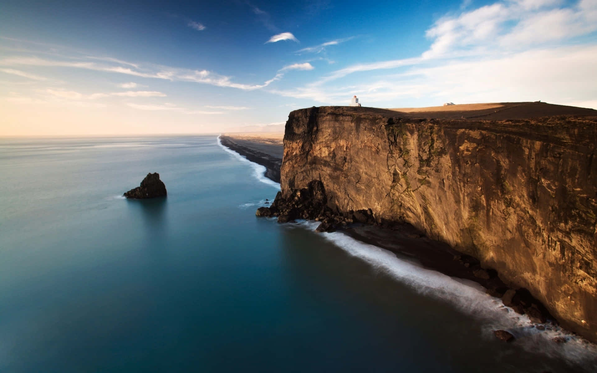 Tremendous Cliff Facing The Ocean Wallpaper