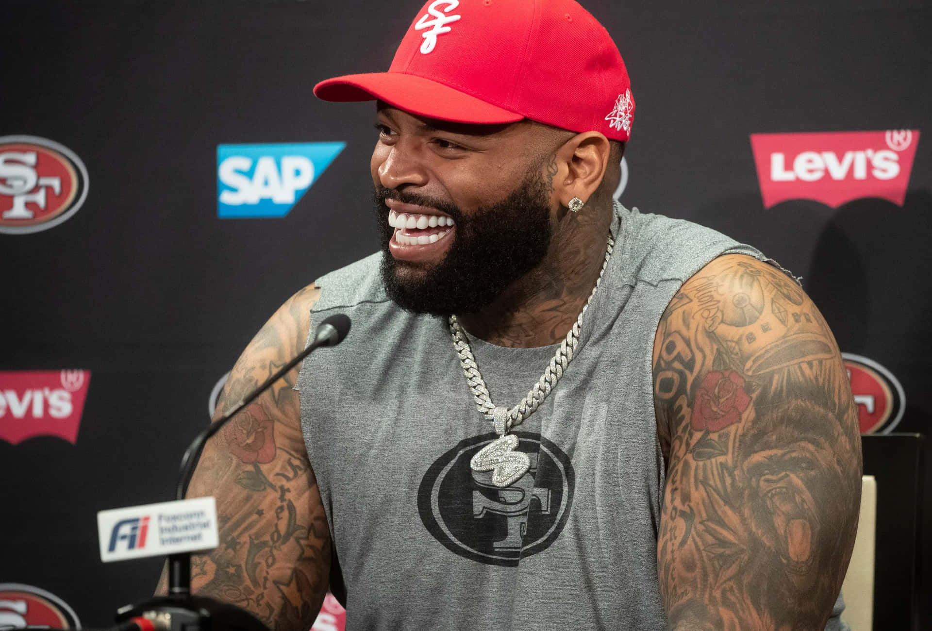 Trent Williams Laughing During Press Conference Wallpaper