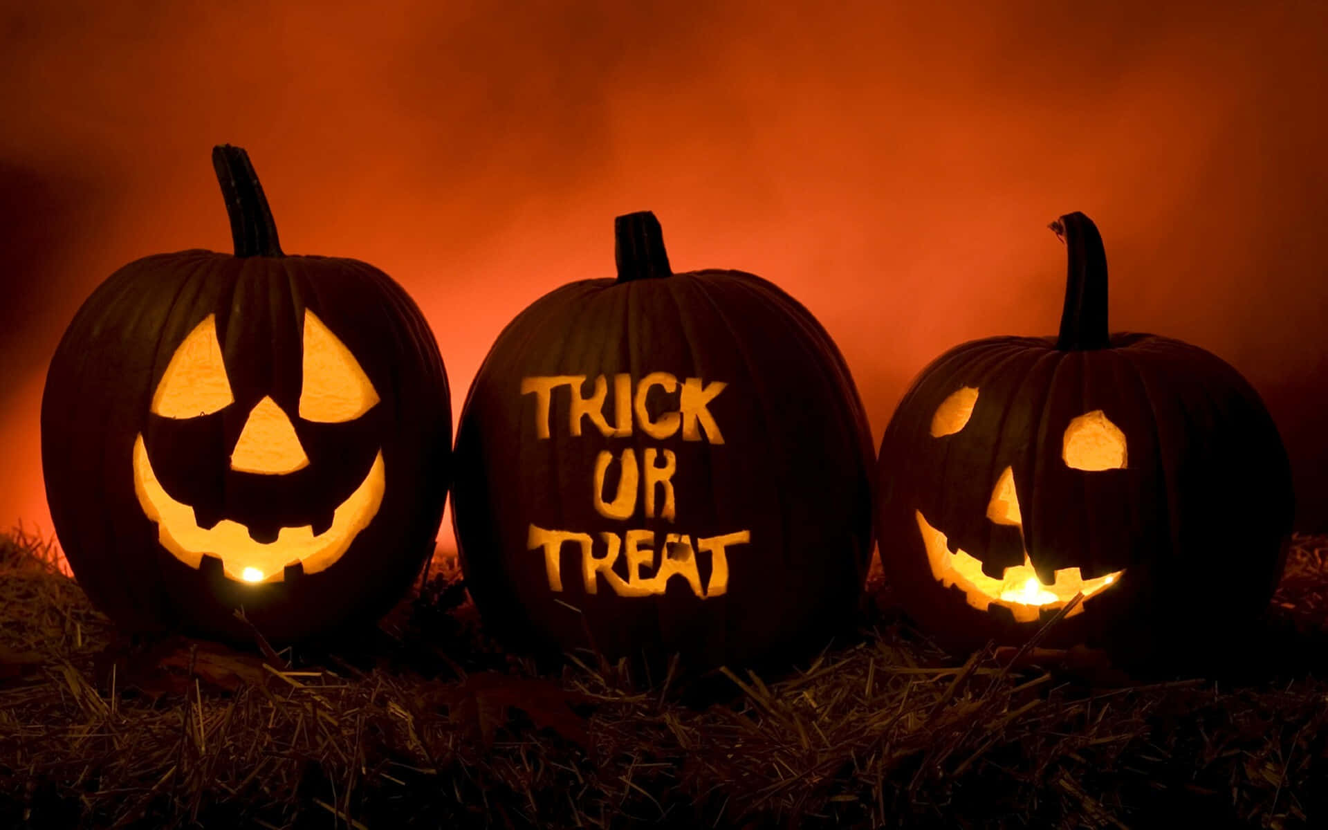 Kids in spooky costumes enjoying Trick or Treat on Halloween night