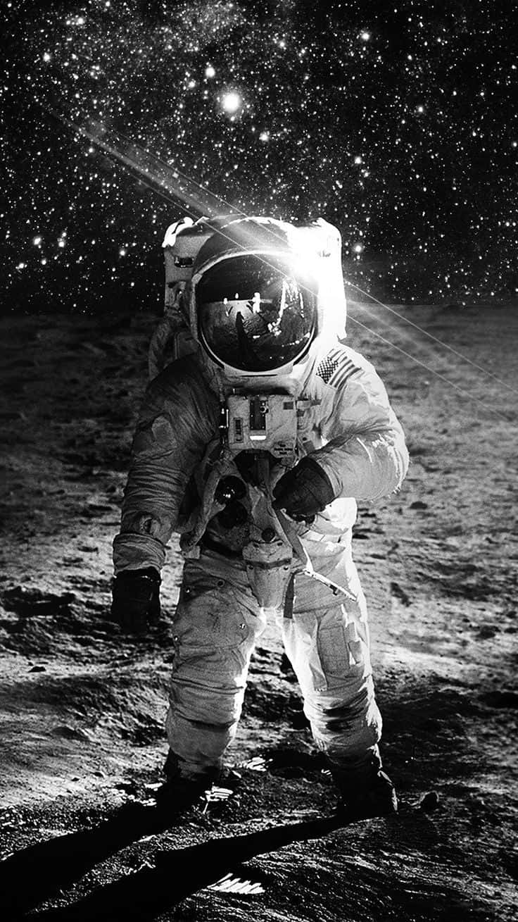 En astronaut drømmer om det uendelige rum. Wallpaper