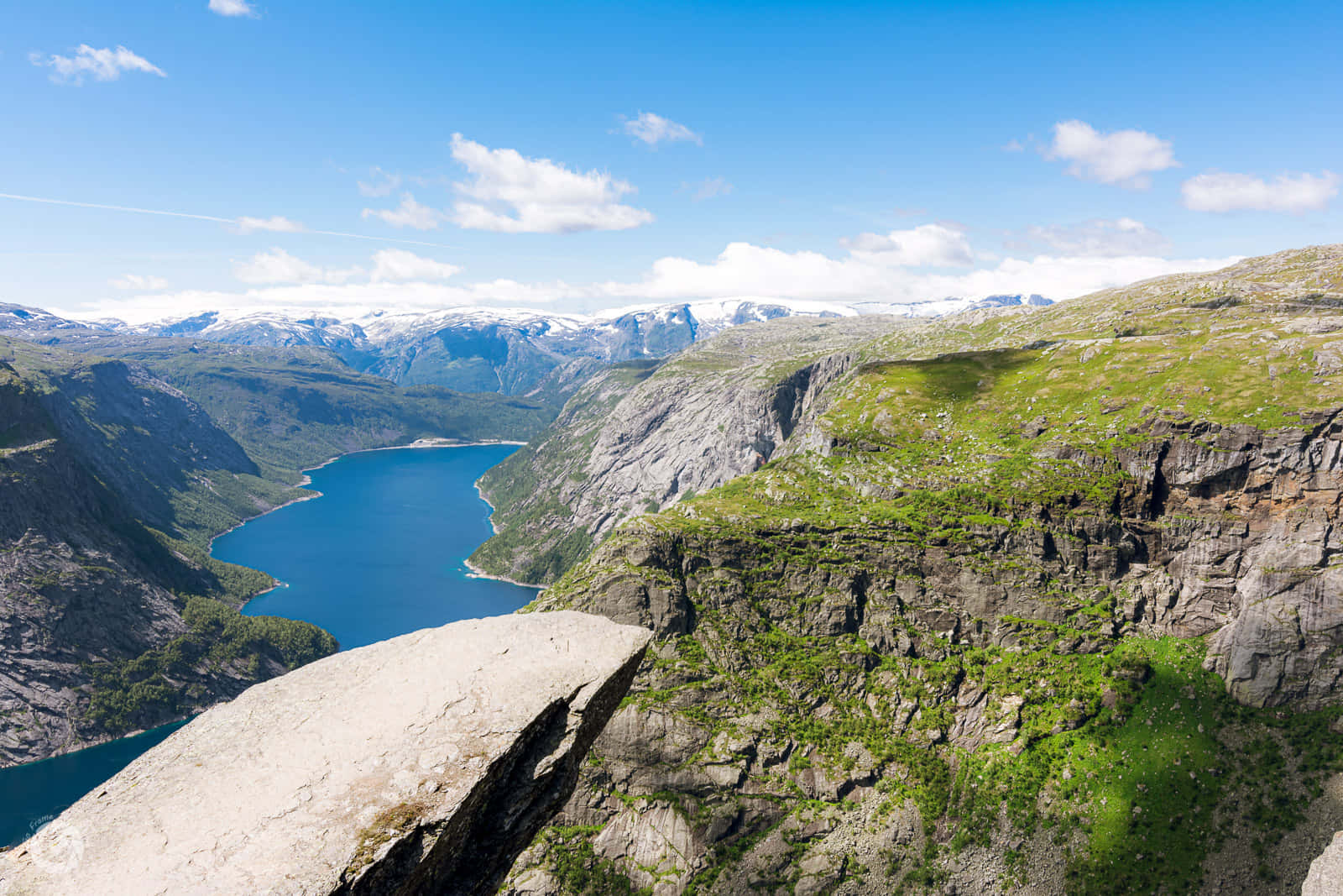 Trolltunga With Clear View Of Green Moss Wallpaper
