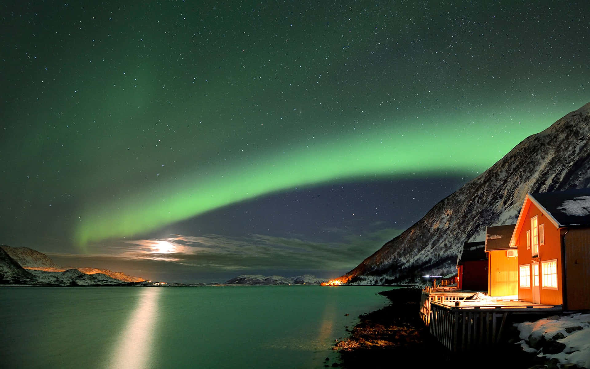 Tromso Northern Lights Over Waterfront Cabin Wallpaper