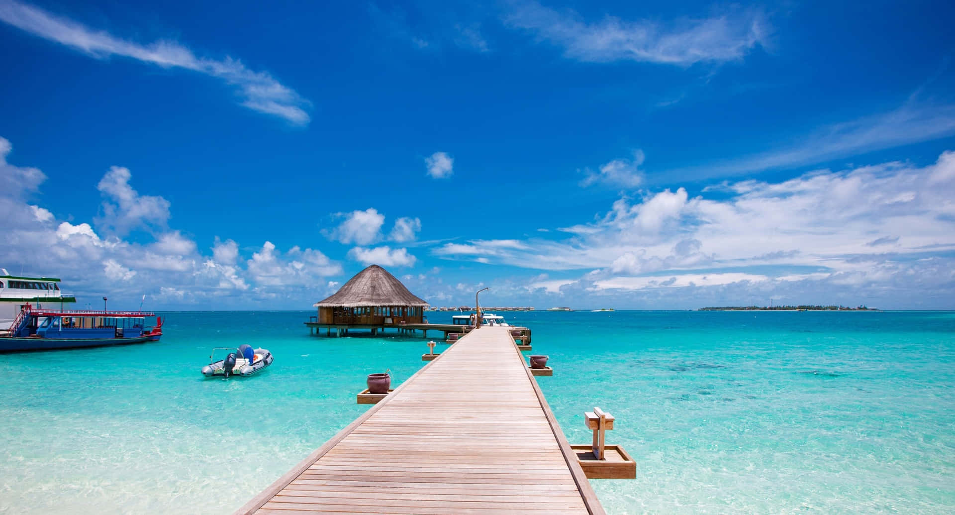 Tropical Paradise Jetty Over Turquoise Water Wallpaper