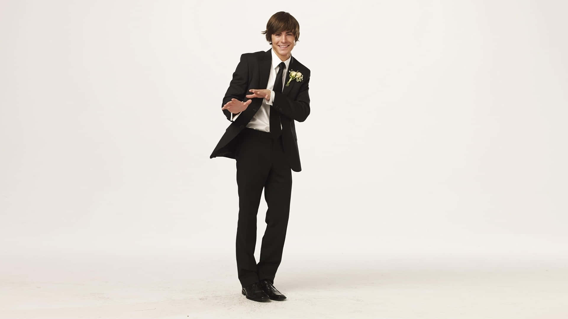 Troy Bolton In A Classic Men Suit Style Wallpaper