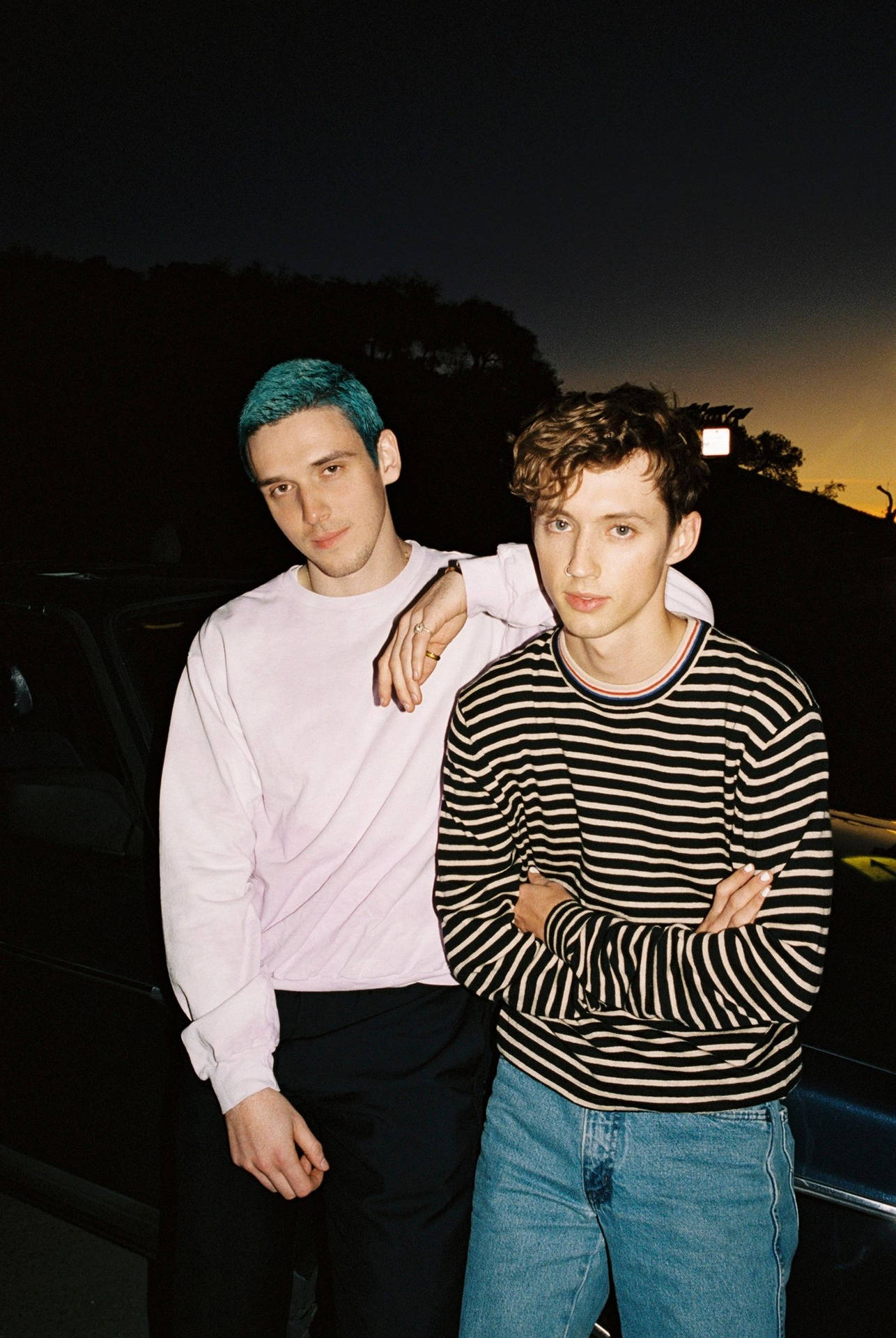 Troye Sivan and Lauv posing in a candid shot for their hit collaboration, "I'm So Tired". Wallpaper