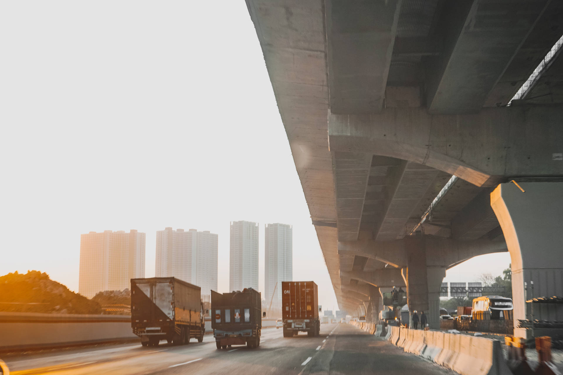 Trucks Highway Near Jakarta Metropolis Wallpaper