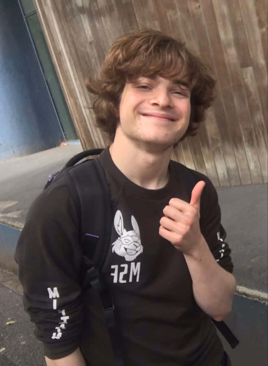 A Young Man Giving The Thumbs Up