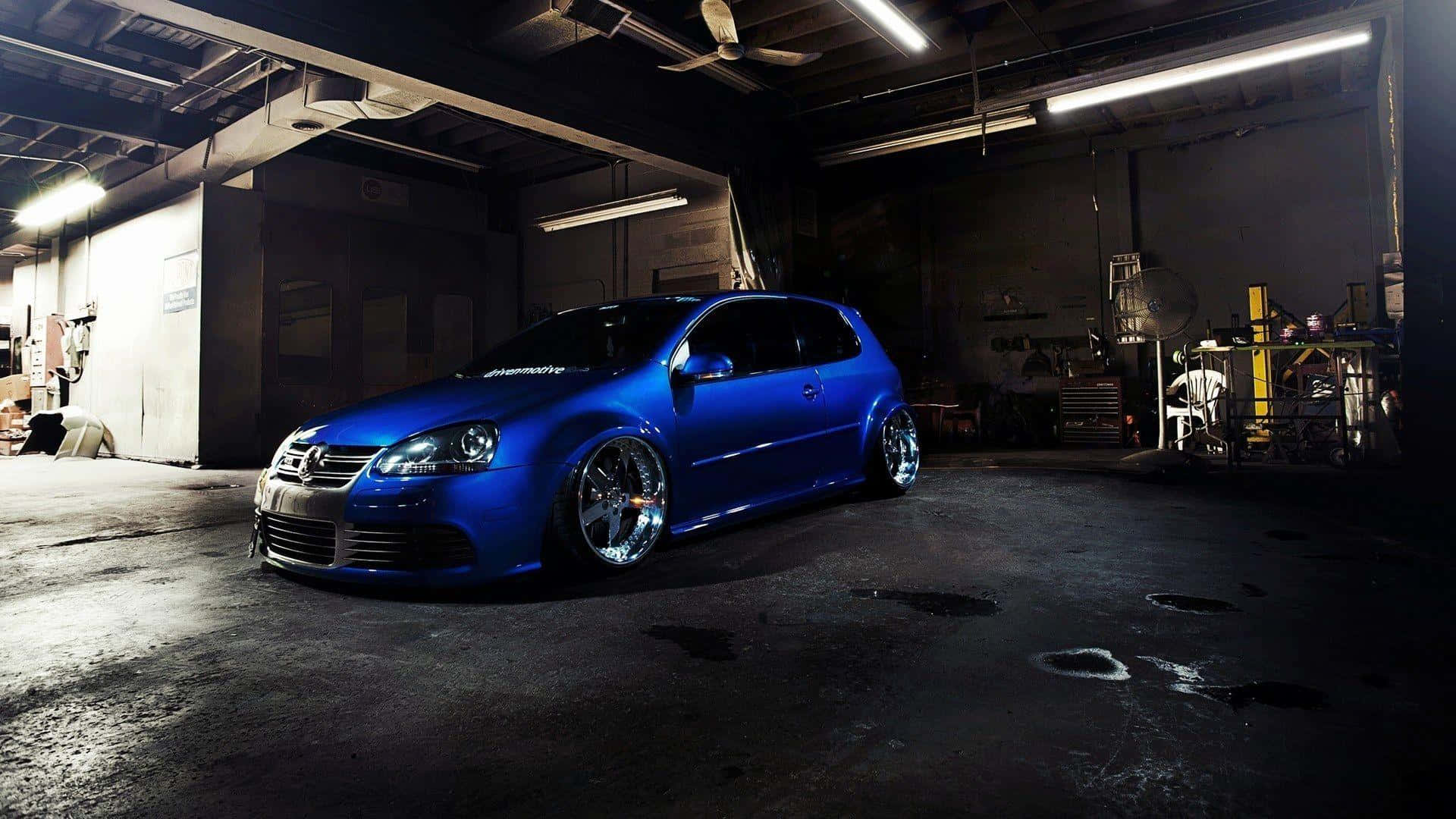 Sleek, Customized Tuned Car on the Road Wallpaper