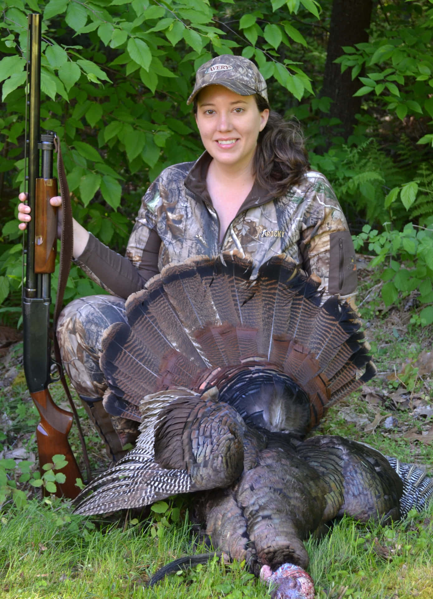 A Woman With A Turkey And A Rifle Wallpaper