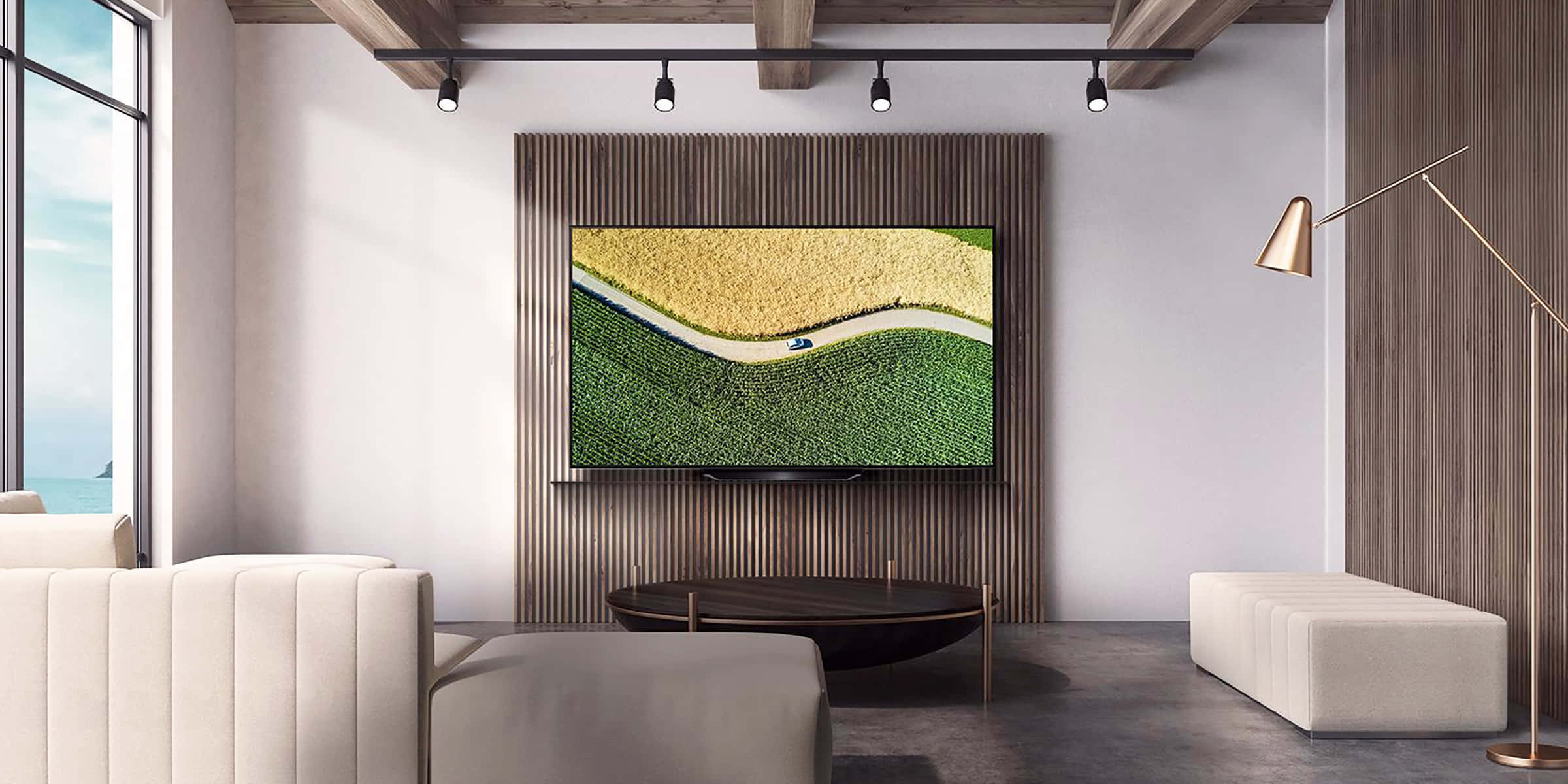 A Living Room With A Large Tv And A Large Painting