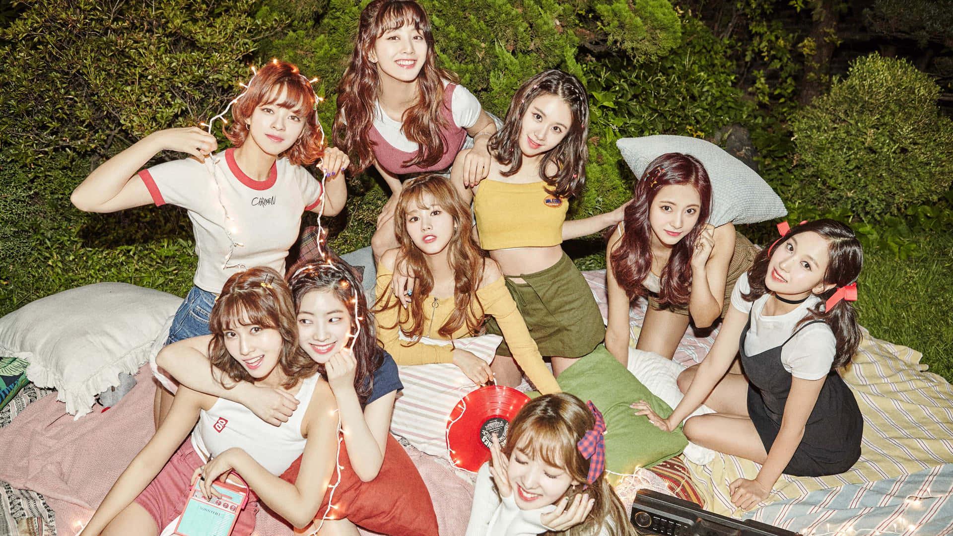 [TWICE Wallpaper: Colorful and vibrant group photo of the members against a sky-blue backdrop]