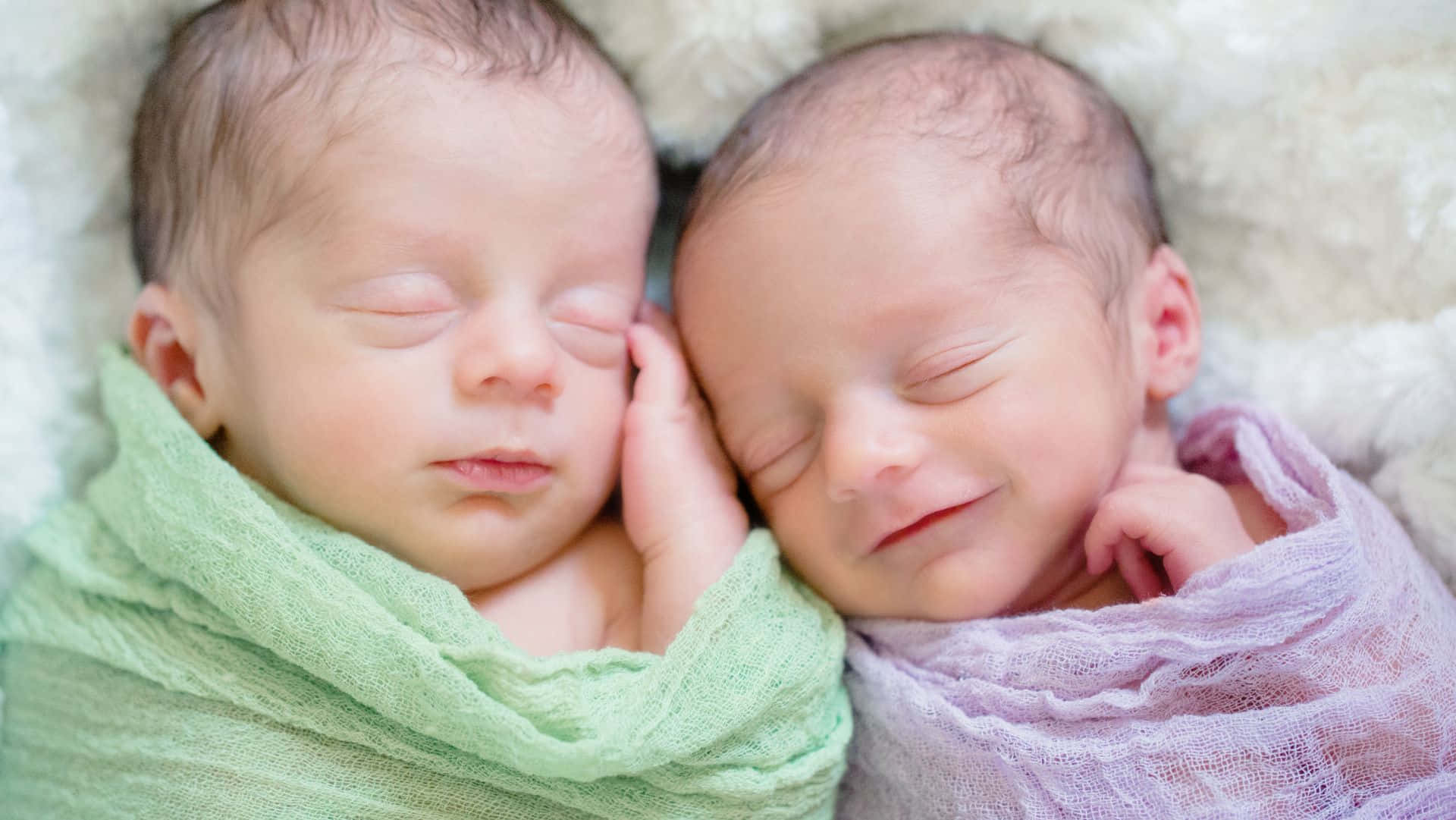 Adorable Twin Babies Smiling Together