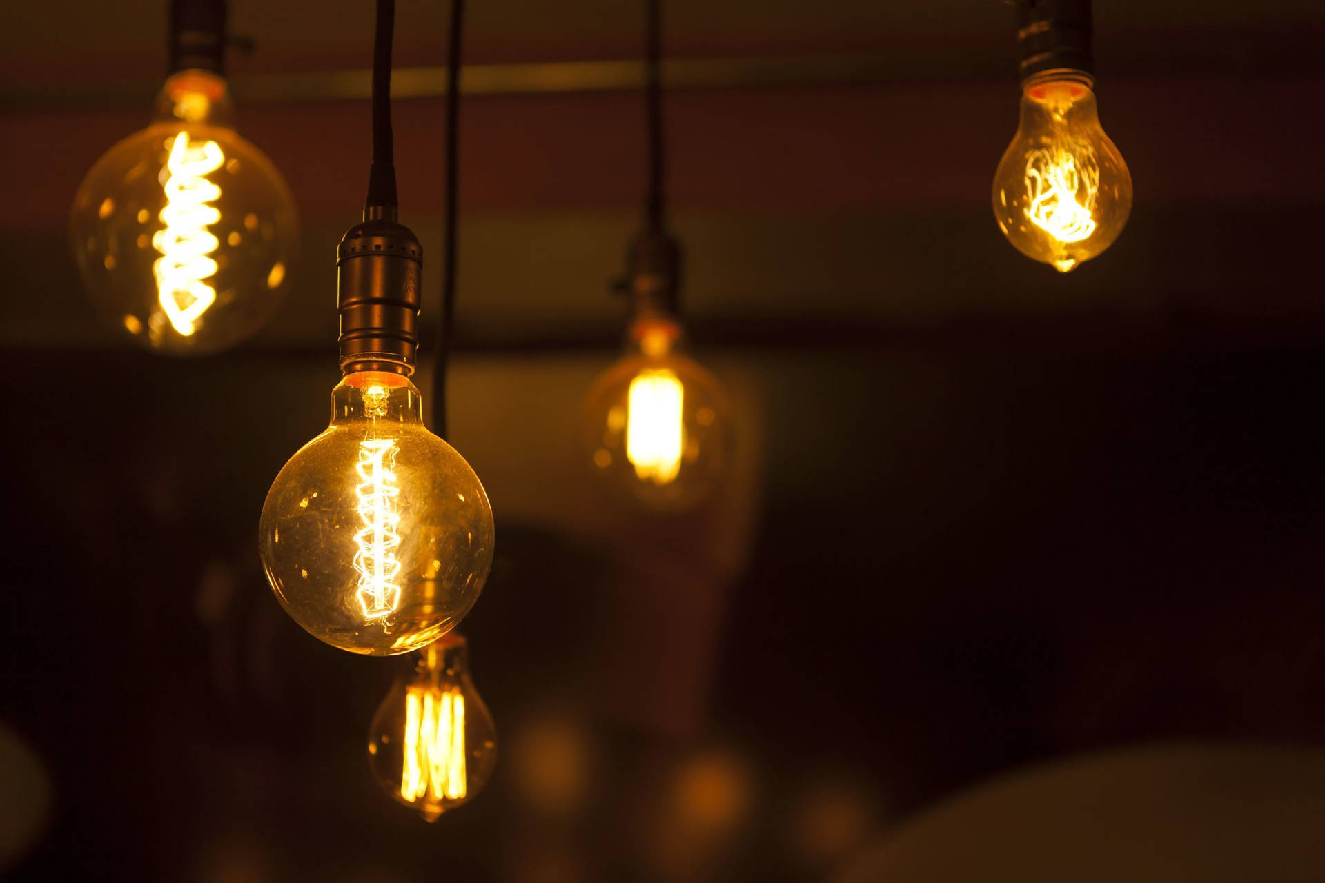 Innovative Spiral Light Bulbs Glowing Brightly Wallpaper