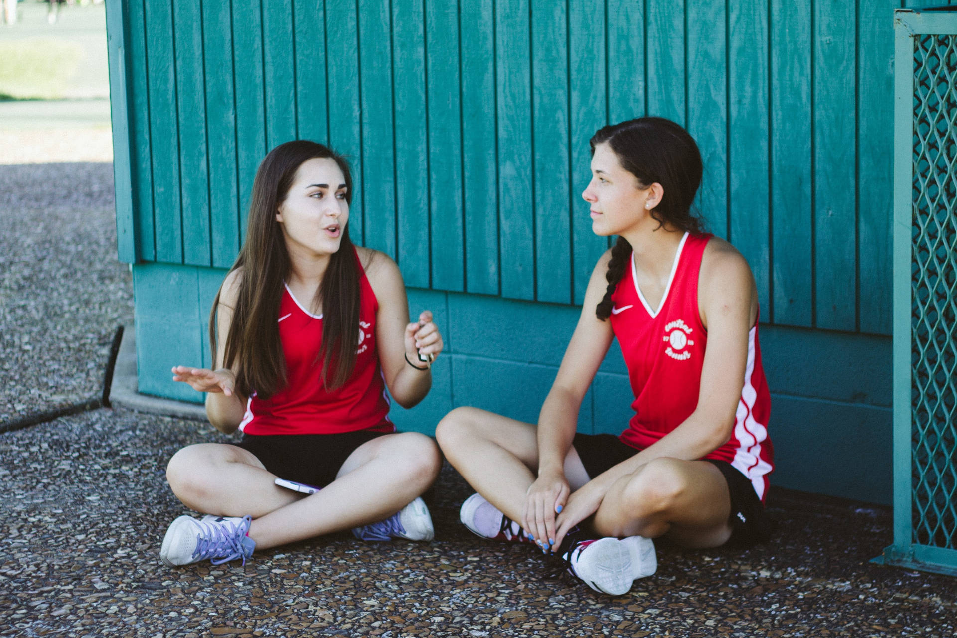 Two Athletes Teenage Girls Talking Wallpaper