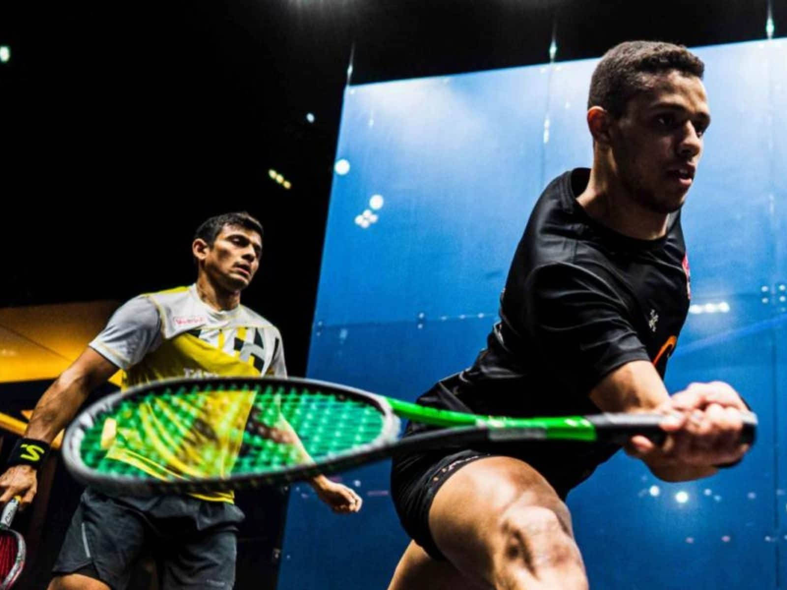 Two Athletic Boys Playing Squash Background