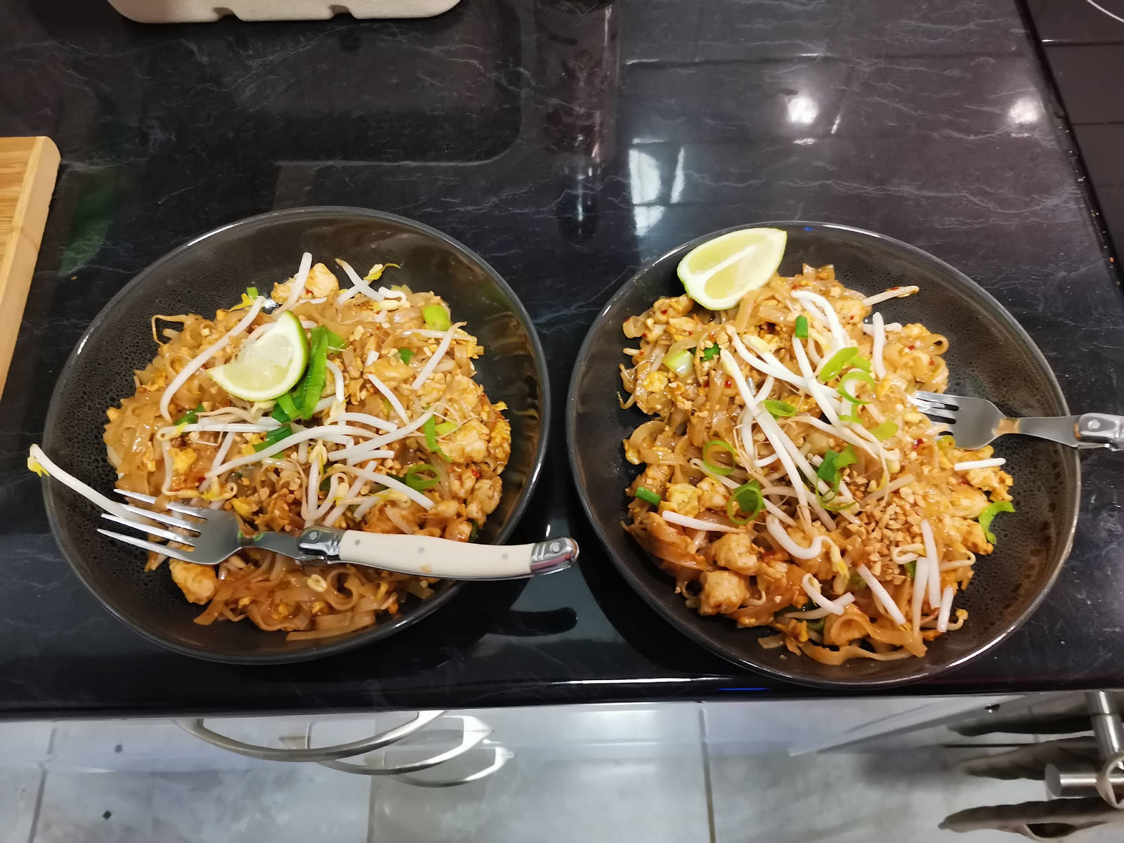 Delicious Pad Thai Noodles in Black Bowls Wallpaper