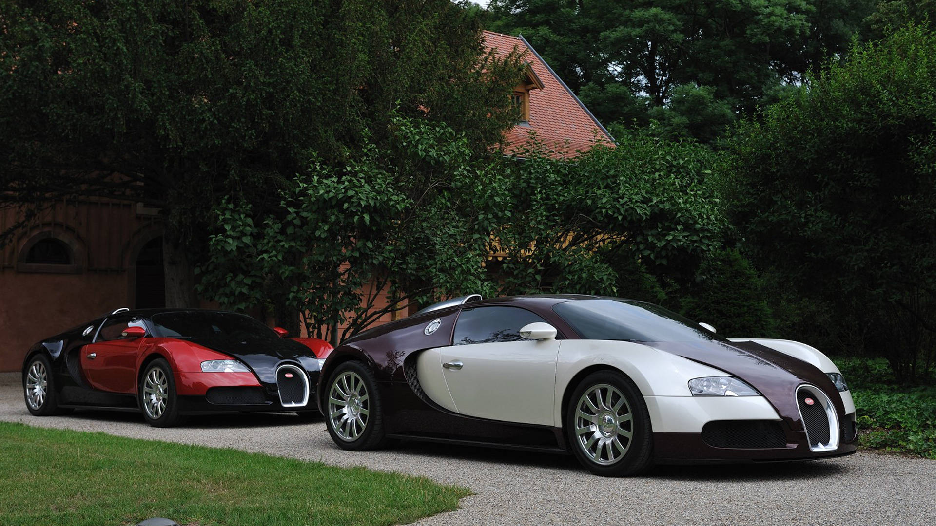 Two Cool Bugatti Cars Parked Wallpaper
