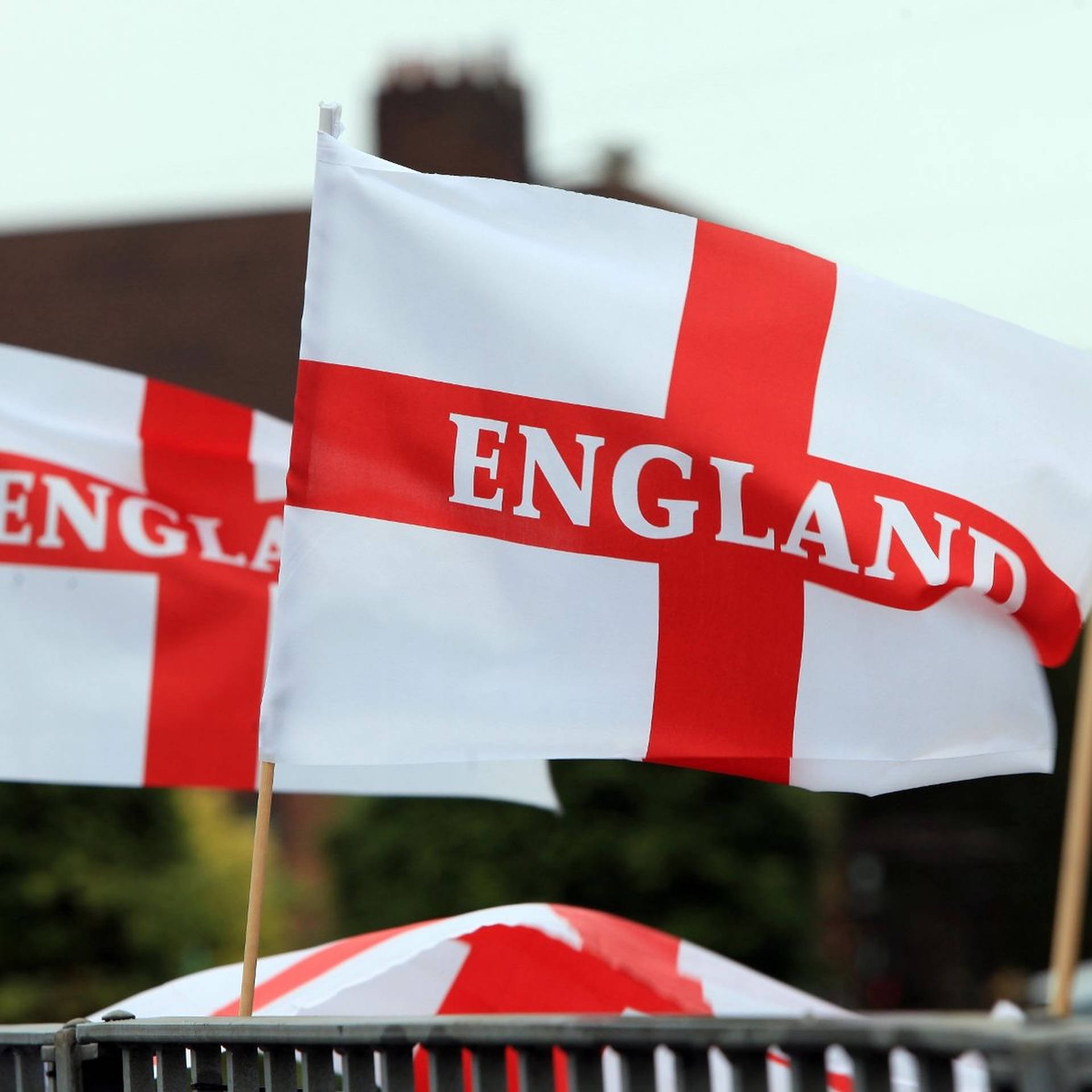 "Two Vibrant England flags Against a Striking Sky" Wallpaper