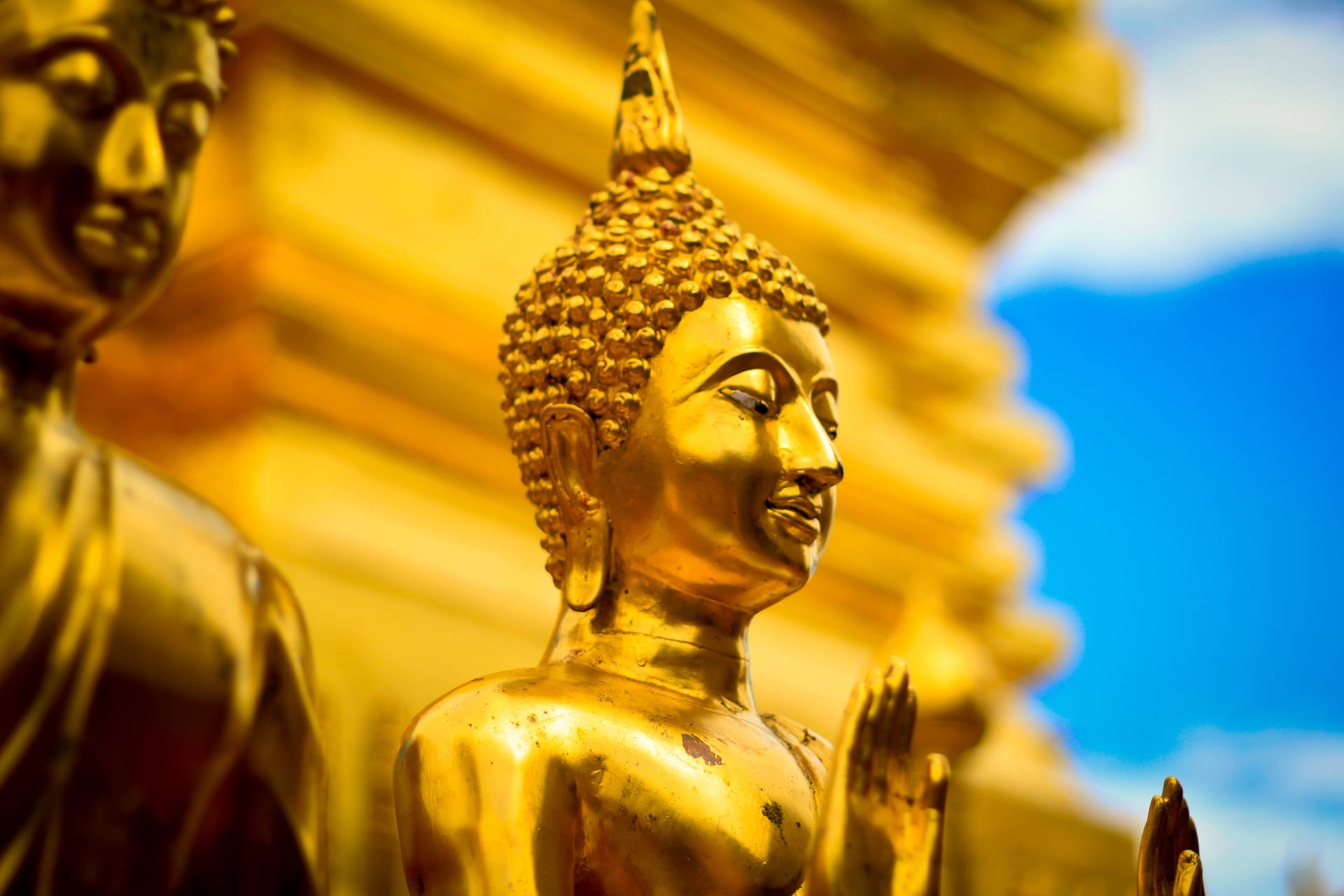 Two Golden Buddha Statues Wallpaper