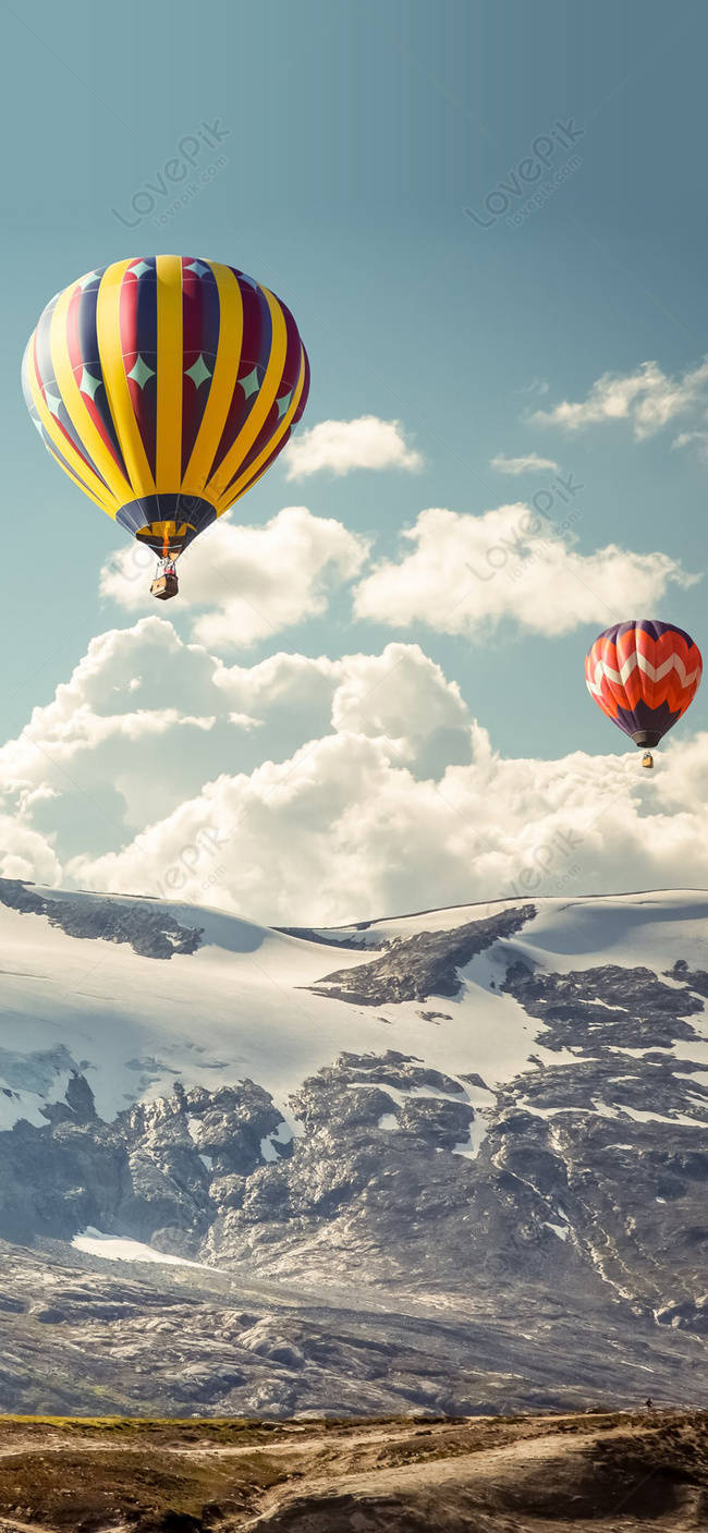 Two Hot Air Balloons Snowy Mountains Wallpaper