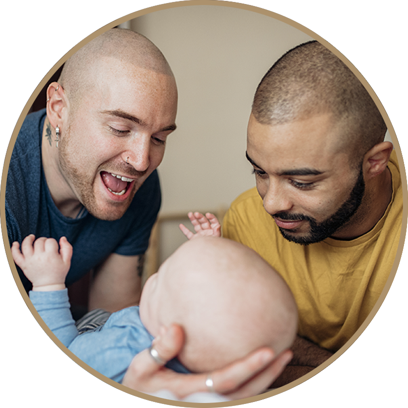 Two Men Admiring Baby PNG