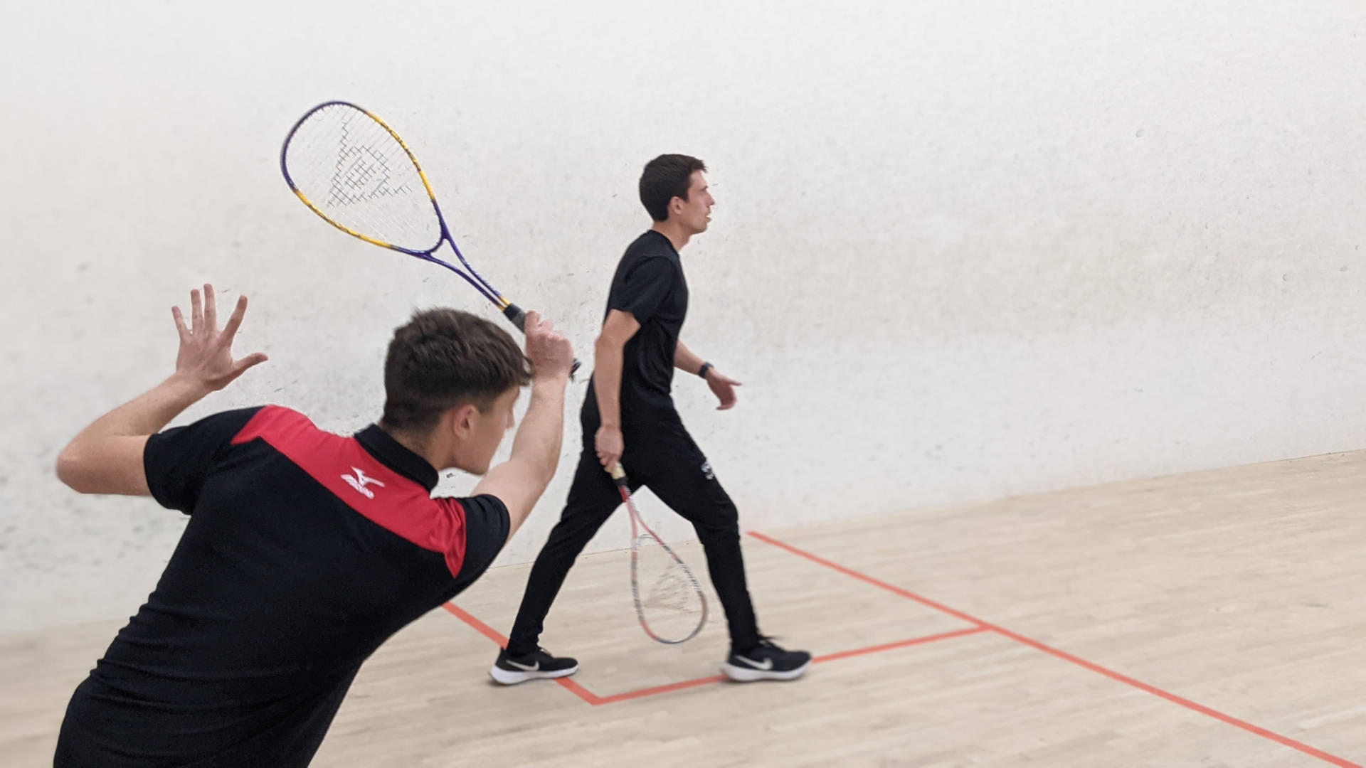 Two Men In Squash Court Background