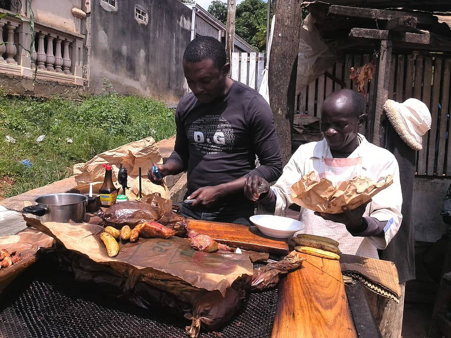 Two Natives In Cameroon Cooking Cuisines Wallpaper