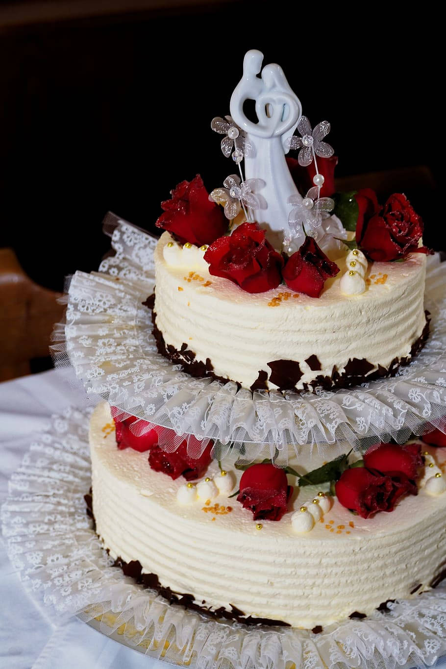Two Tier Wedding Cake With Roses And Porcelain Figurine Wallpaper