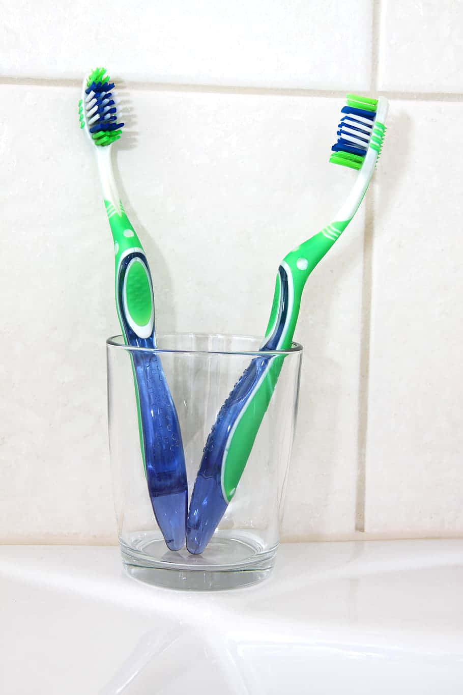 Two Toothbrushesin Glass Wallpaper