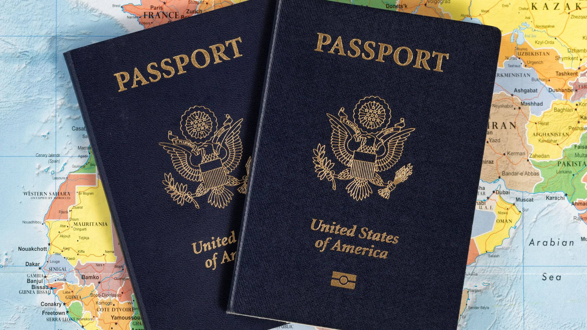 Two USA Passport On World Map Wallpaper