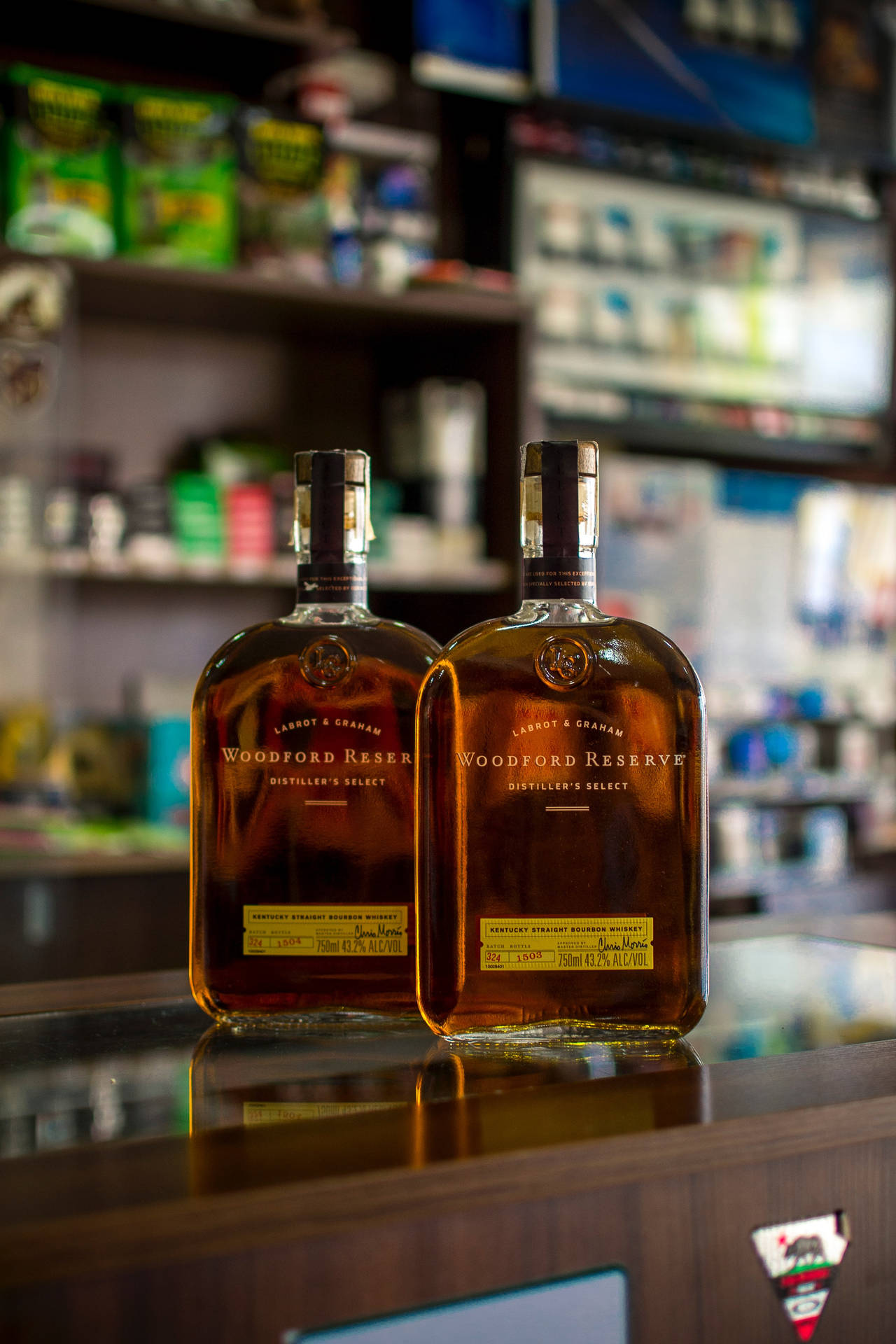 Two Whiskey Bottles On Bar Counter Wallpaper