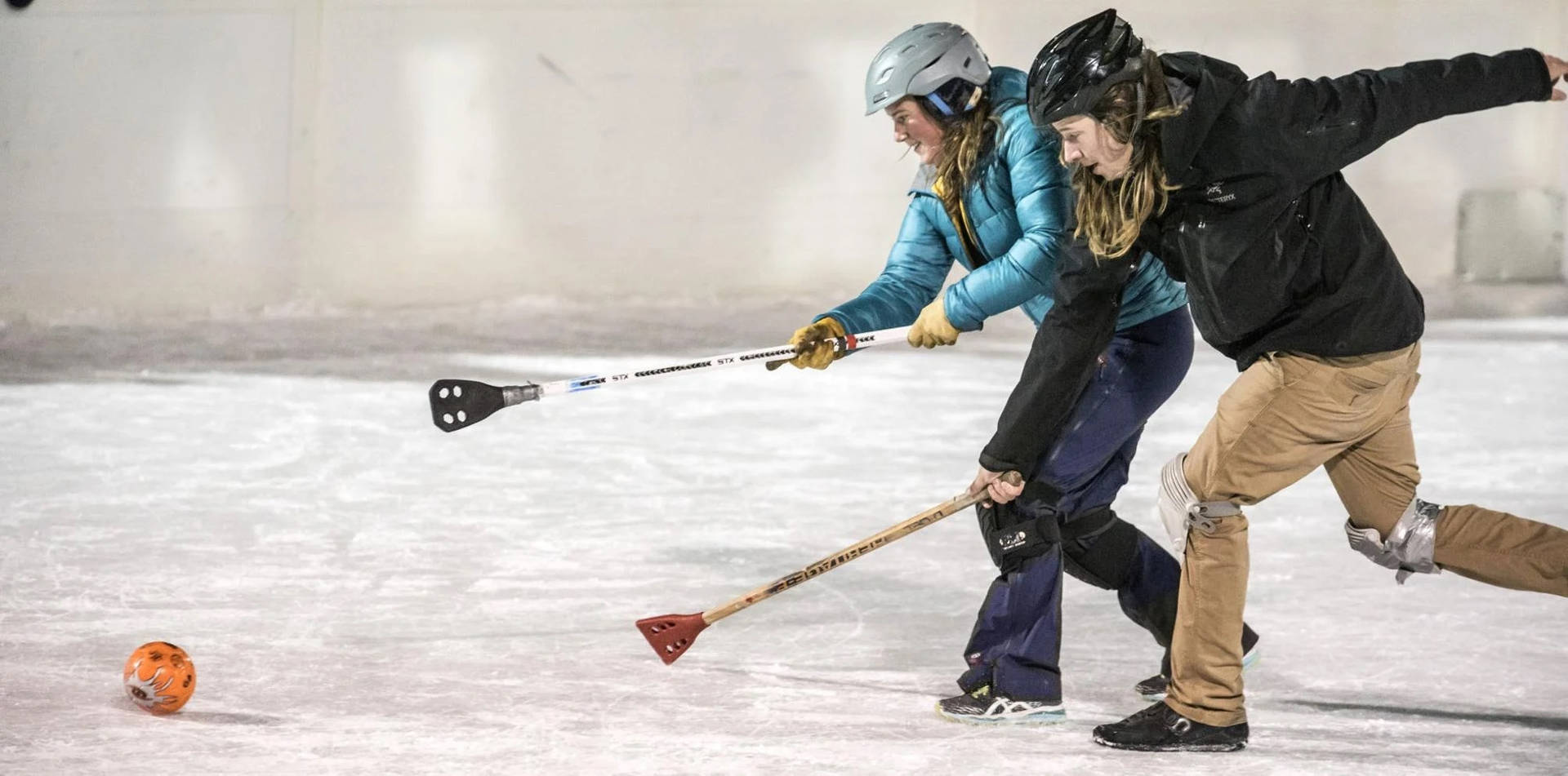 Two Women Broomball Players Wallpaper