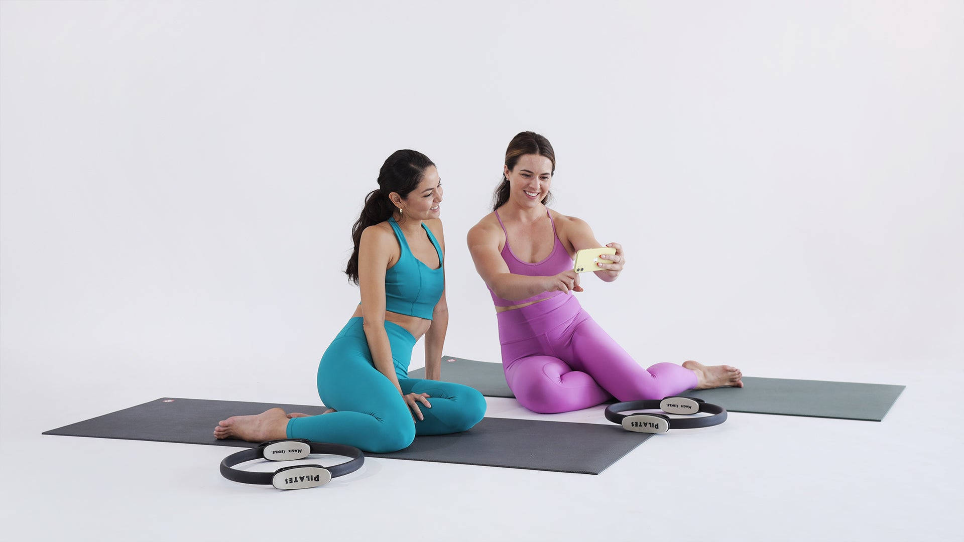 Two Women Pilates Exercise Wallpaper