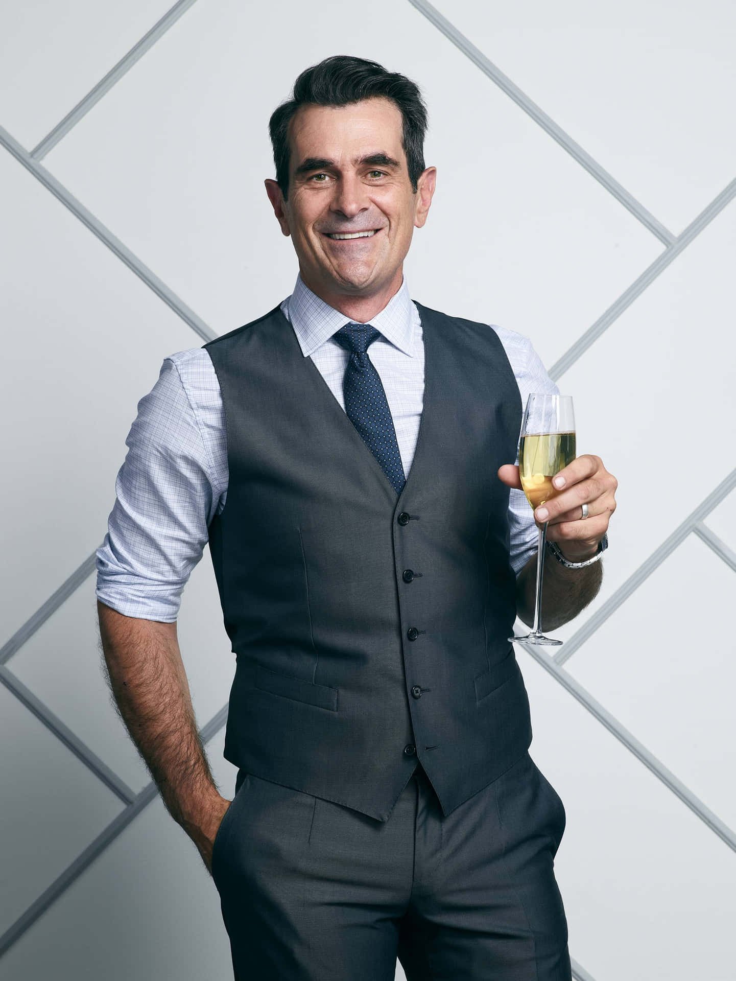 Ty Burrell, Smiling in a Black Suit and Tie Wallpaper