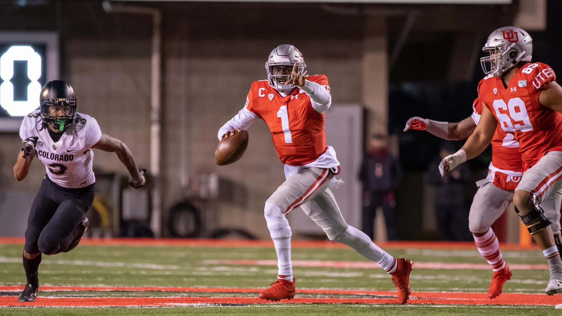 Tyler Huntley Evading Defense During Game Wallpaper