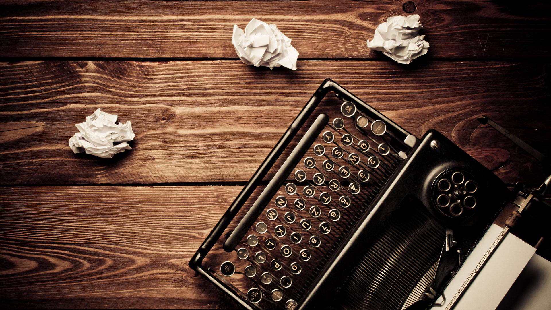 Typewriter With Crumpled Papers Content Wallpaper
