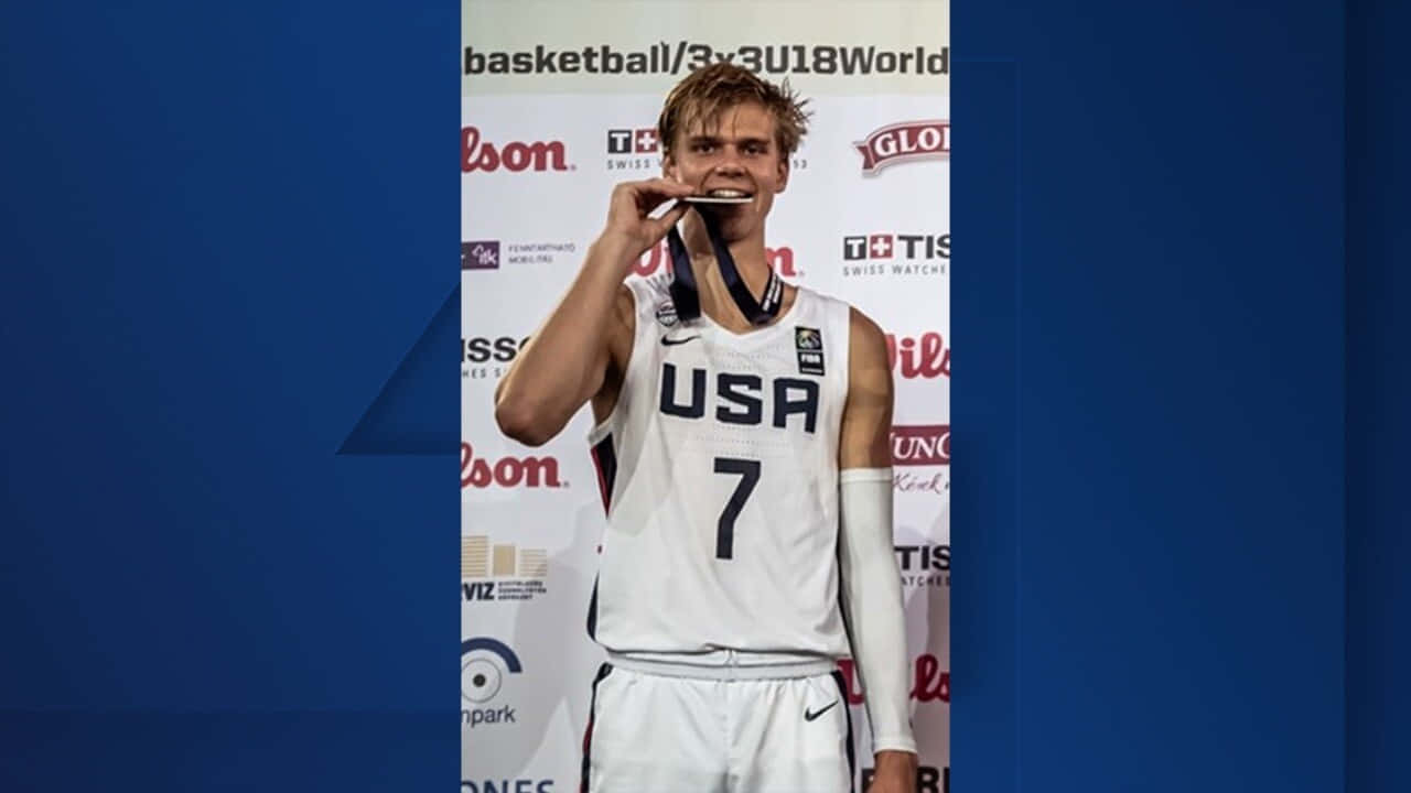 U S A Basketball Player Biting Medal Wallpaper