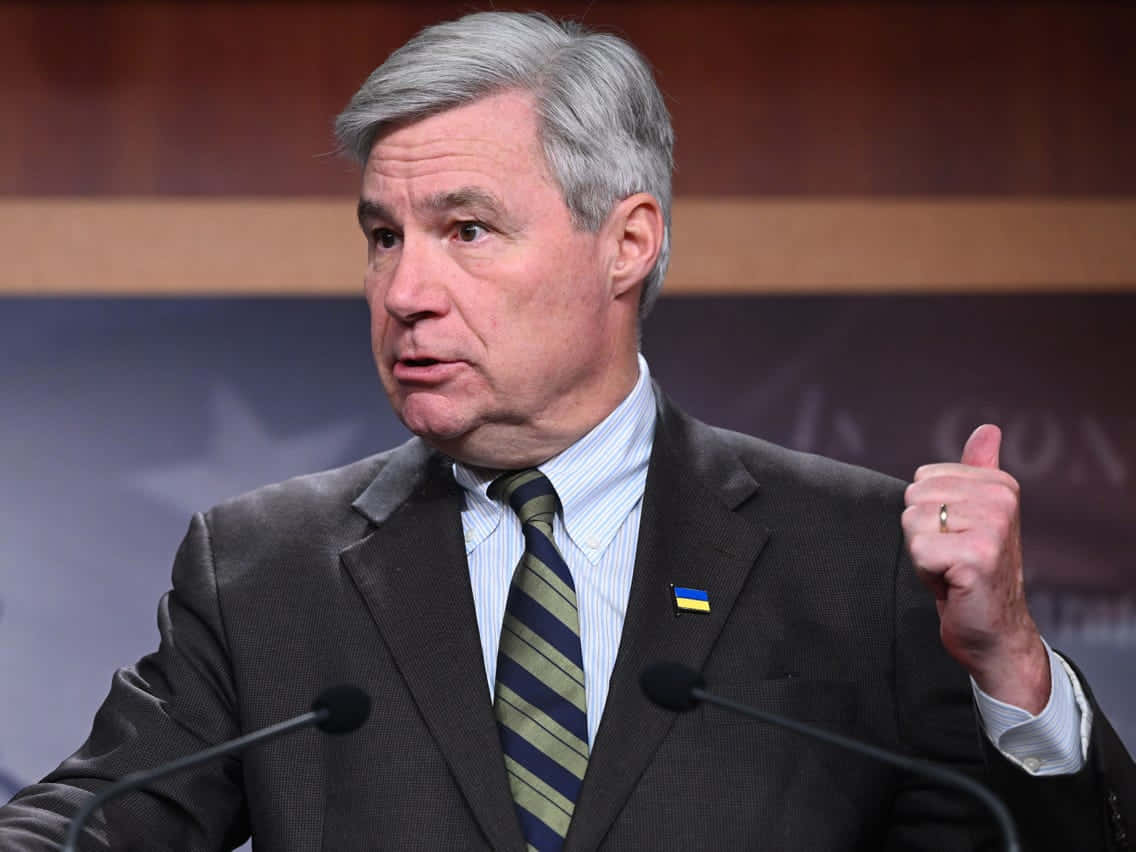 U.s. Senator Sheldon Whitehouse In An Intense Discussion During A Meeting Wallpaper