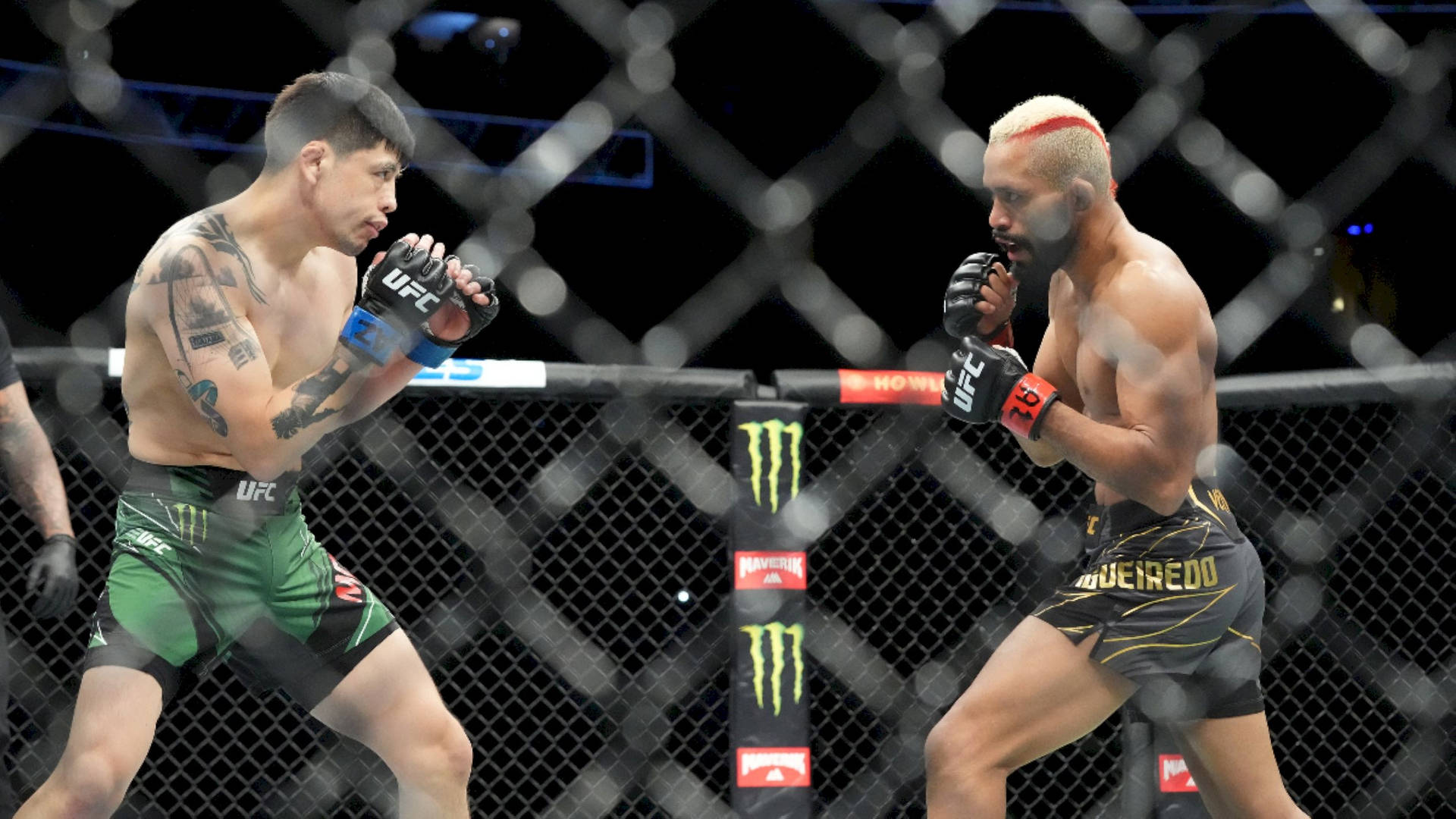UFC fighter Deiveson Figueiredo in action against Brandon Moreno Wallpaper