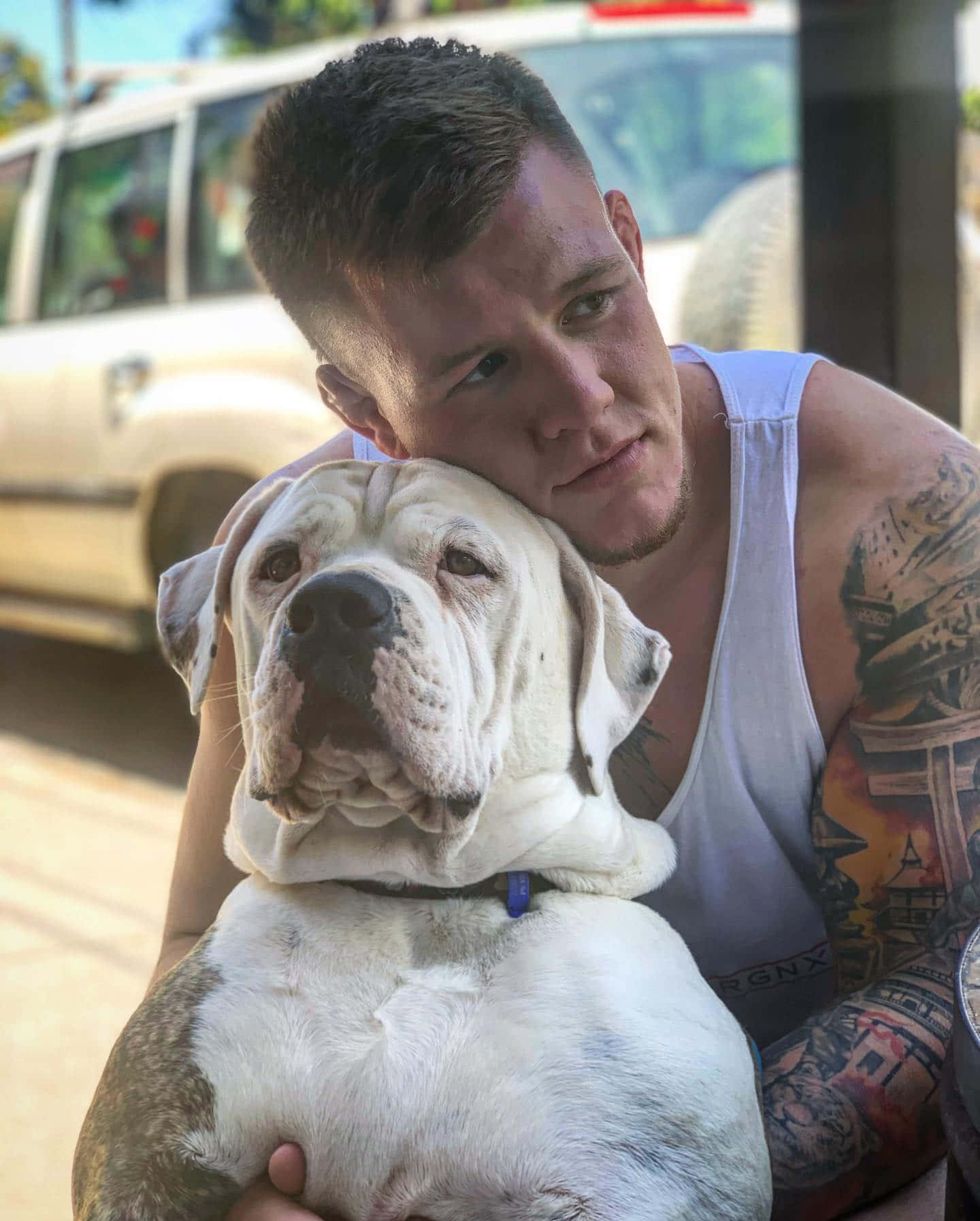 Ufc Fighter Jimmy Crute Hugging His Dog Wallpaper