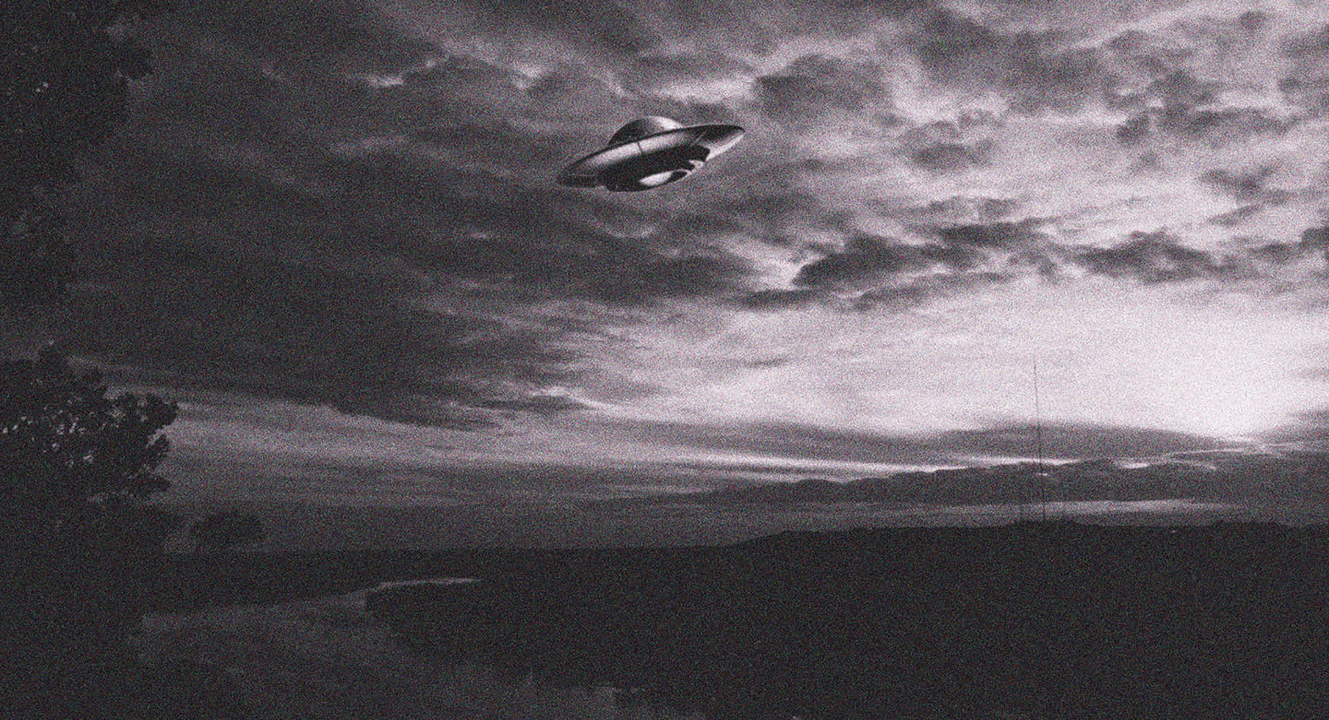 A mysterious unidentified flying object hovering in the night sky