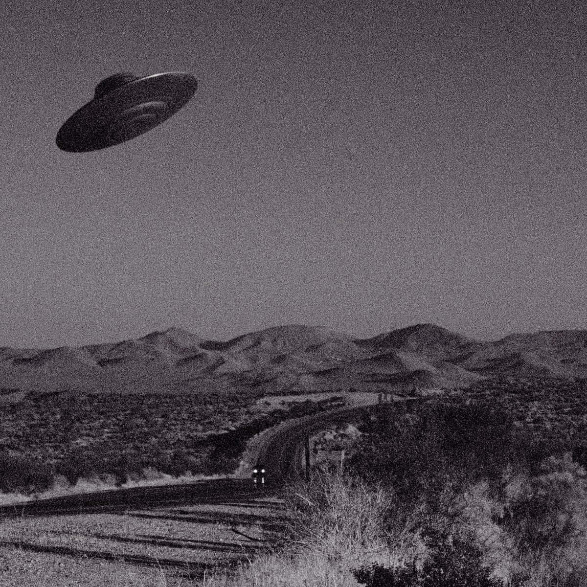 A Black And White Photo Of A Flying Saucer