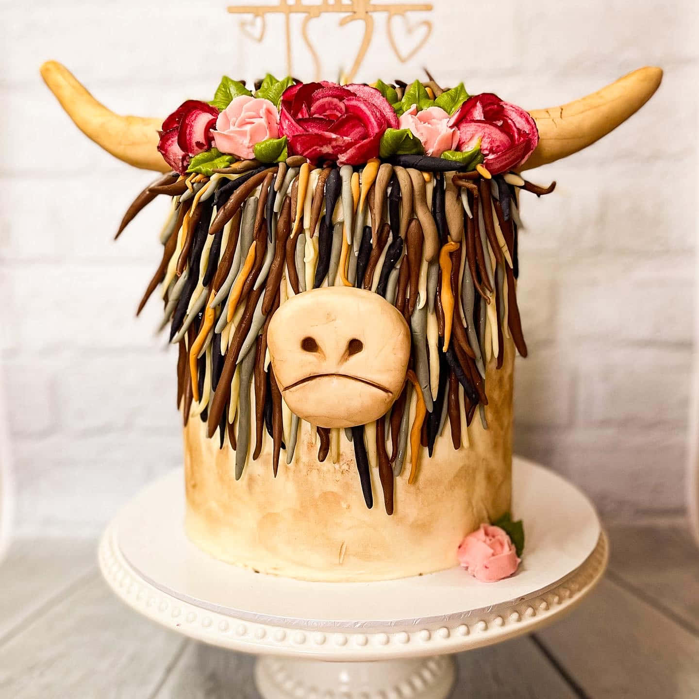 A Cake With A Cow Head On It
