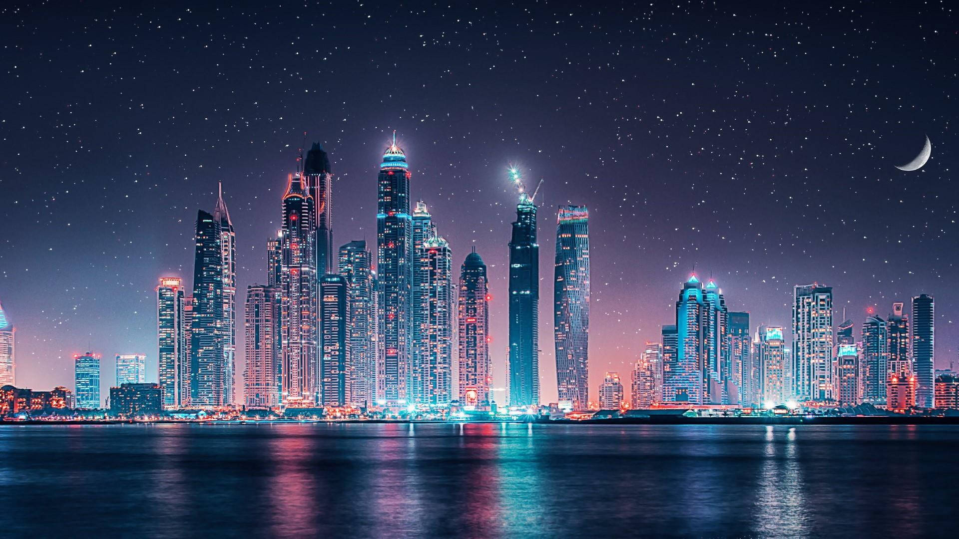 Download Ultra Hd Dubai Skyline Under Stars Laptop Wallpaper | Wallpapers .com