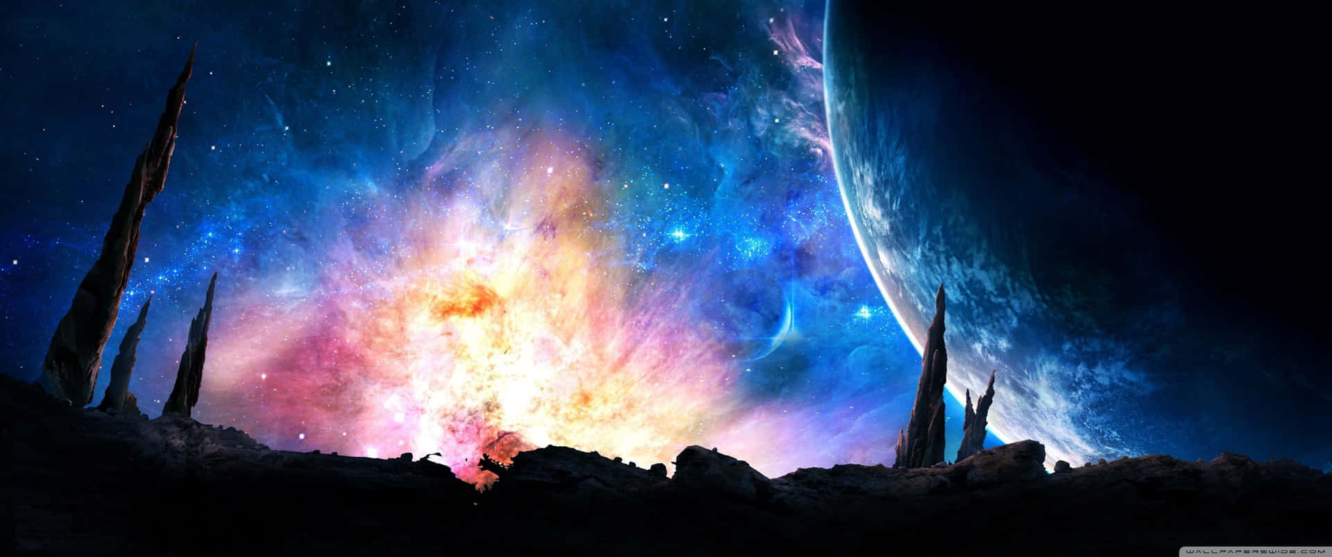 Et farverigt rum baggrund med en planet og stjerner Wallpaper