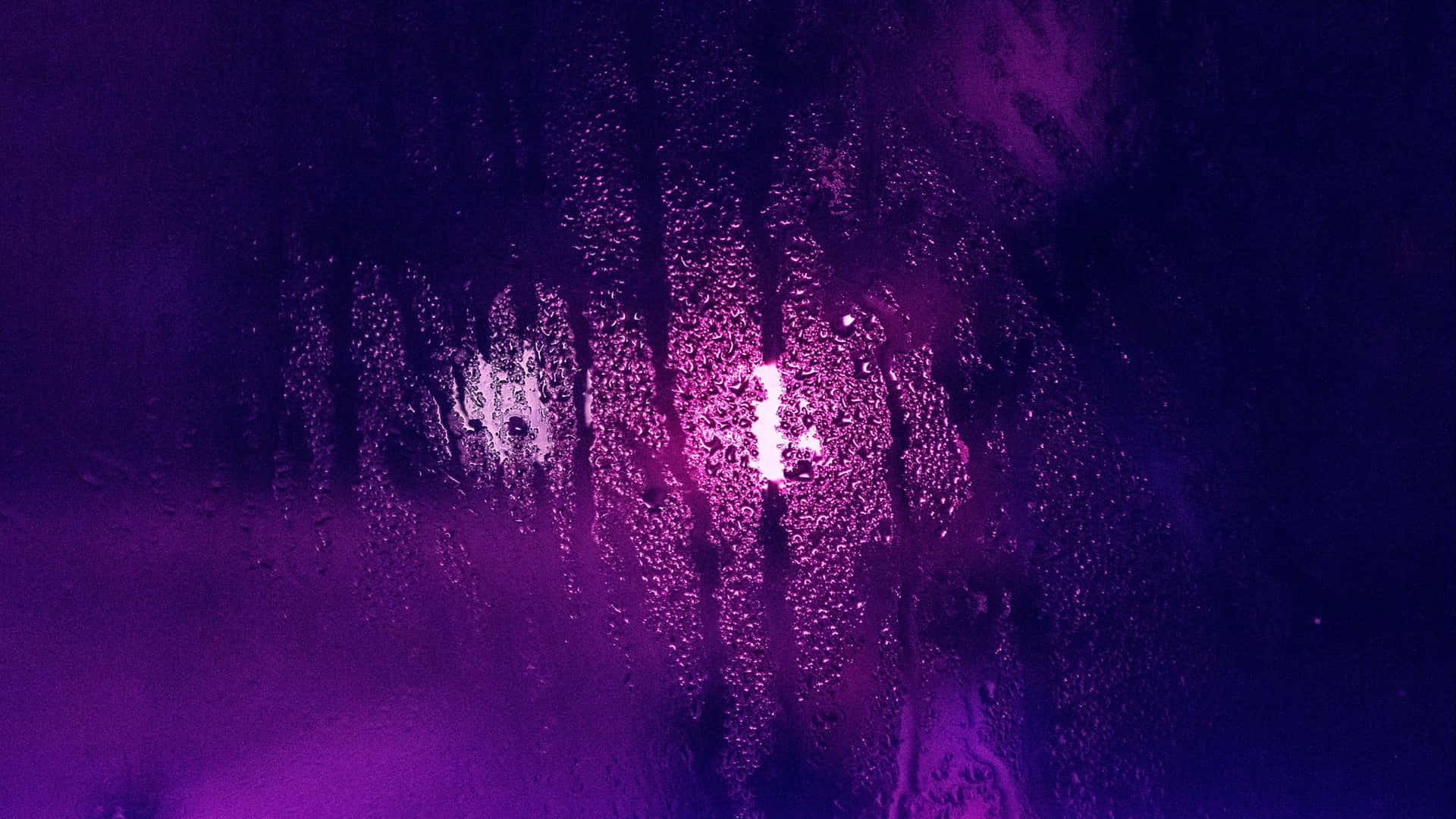 Ultraviolet Lights Against A Moist Glass Wallpaper