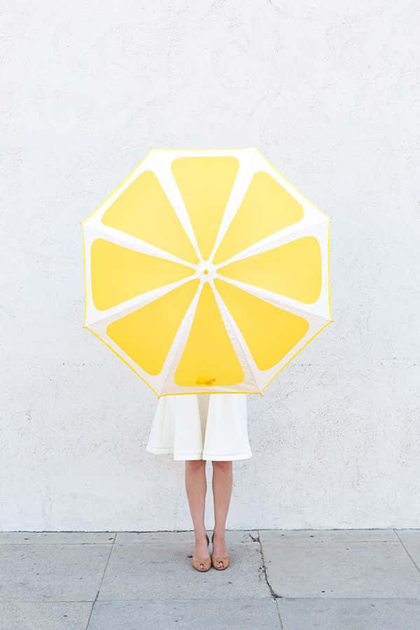 A Person Holding An Umbrella