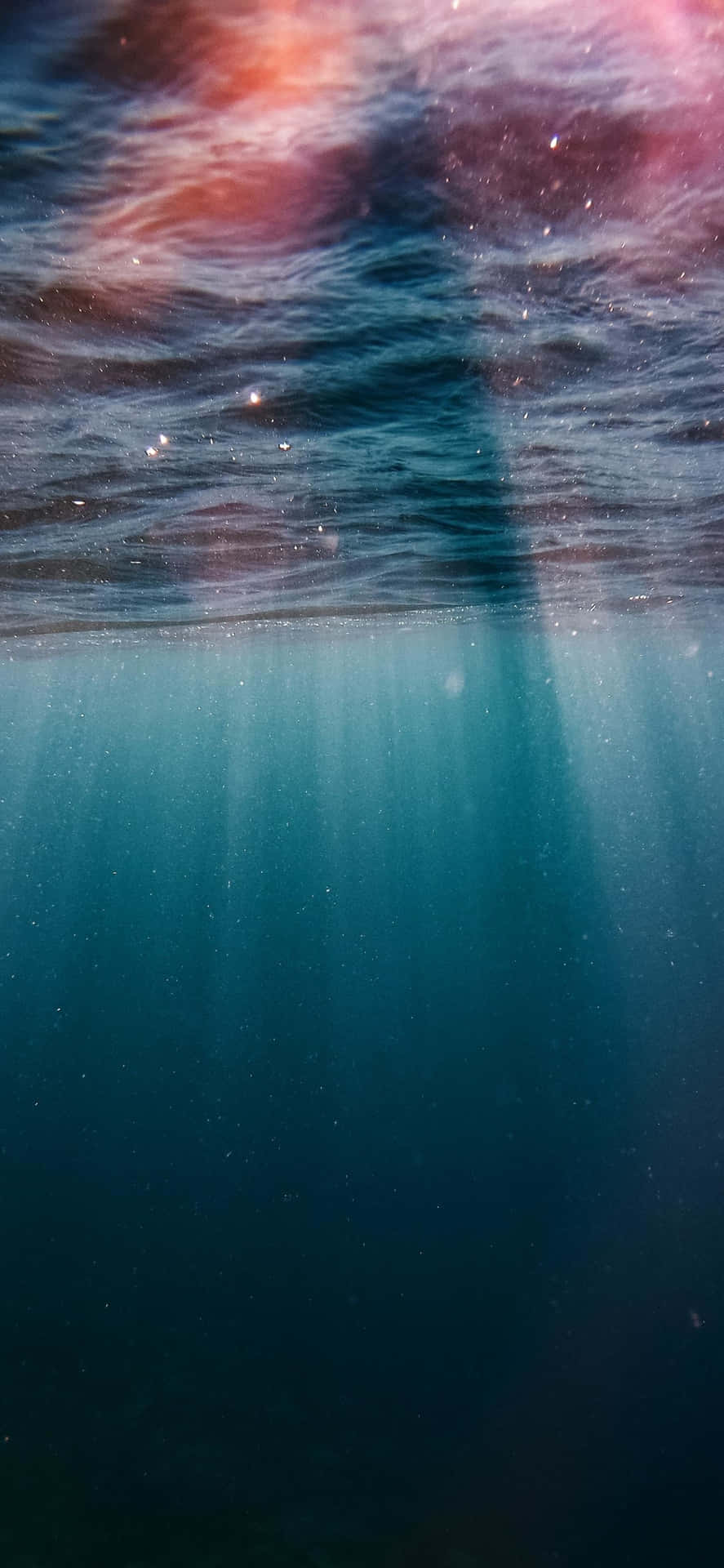 Red Rays Underwater Iphone Wallpaper
