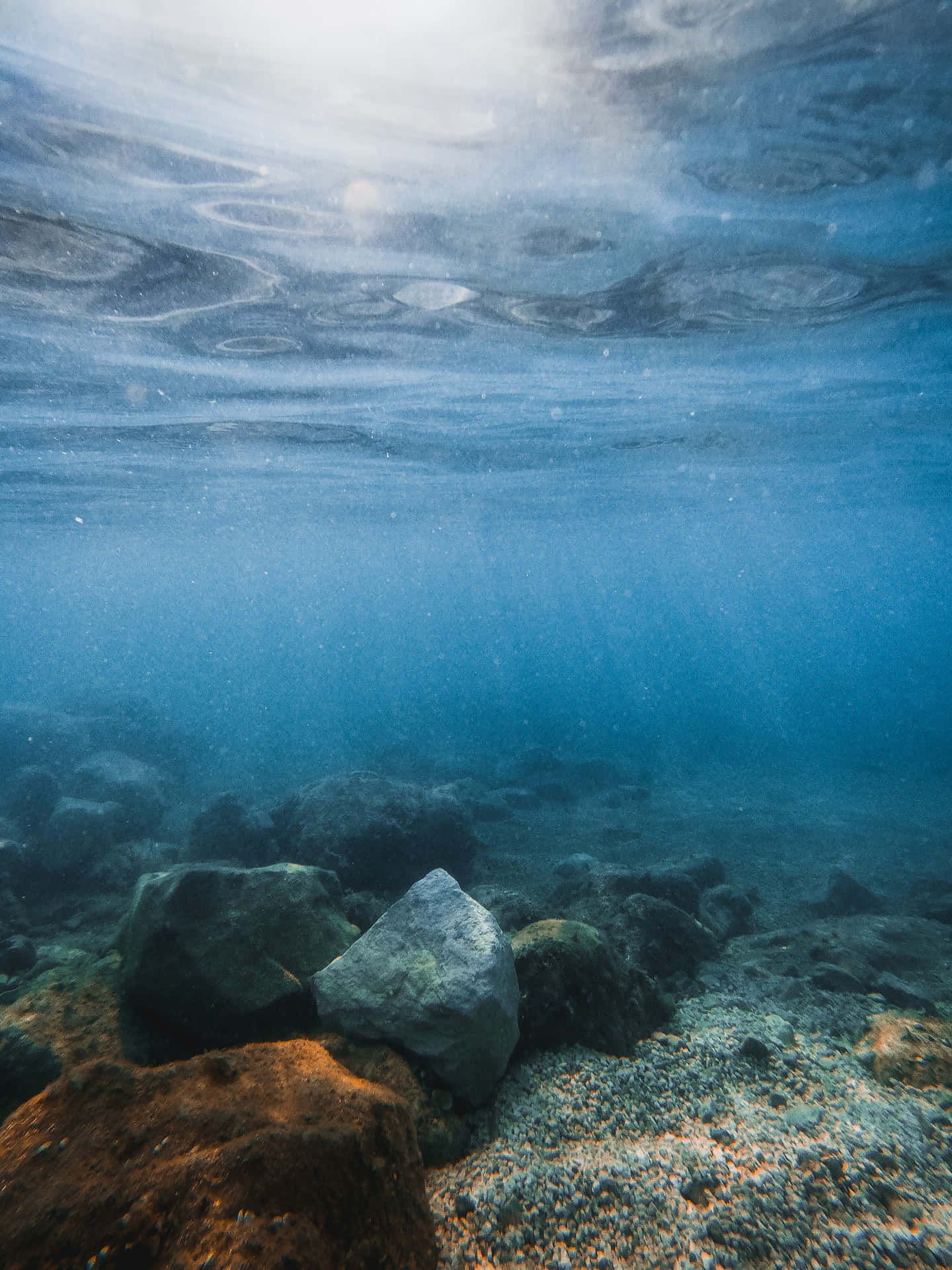 Underwater Ocean Scene With Rocks And Sun