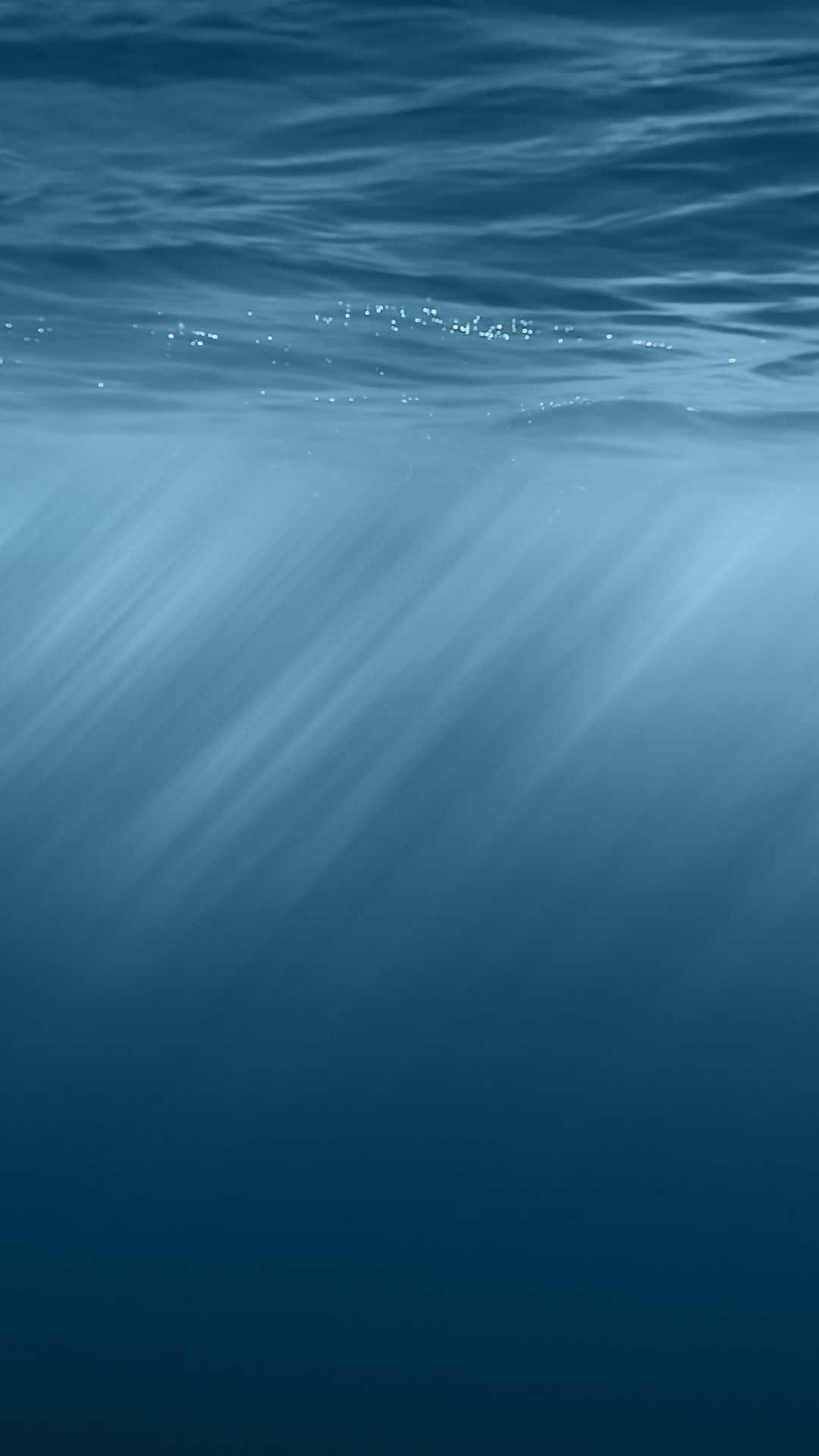 Underwater Sunlight Rays Blue Ocean Background Wallpaper